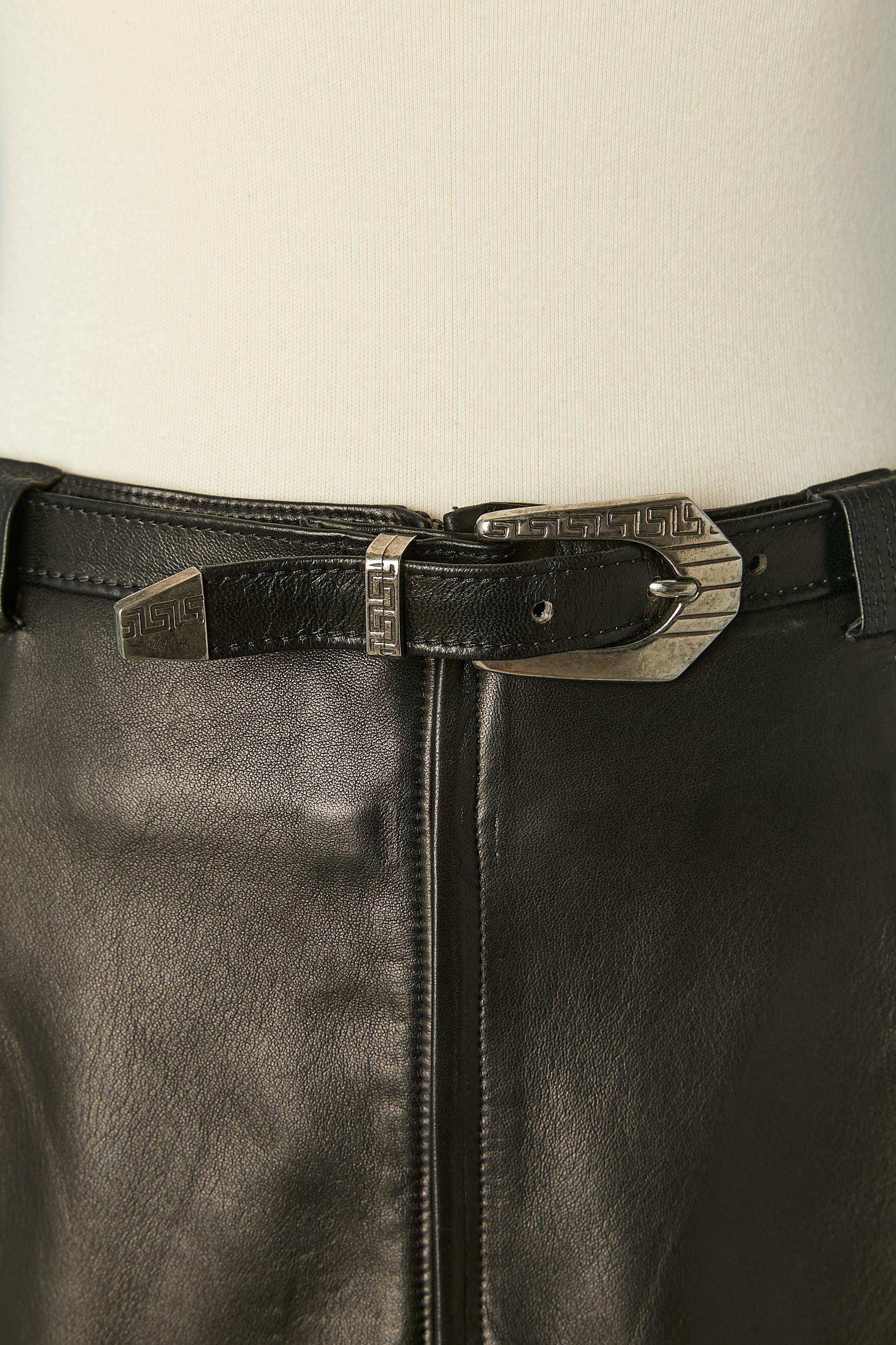 Iconic black leather skirt with safety pin. Lining composition: 100% rayon.
This is the collection in which Gianni Versace showed the killer gold safety-pin dress worn to such eye-popping effect by Elizabeth Hurley.
Zip closure in the middle back (