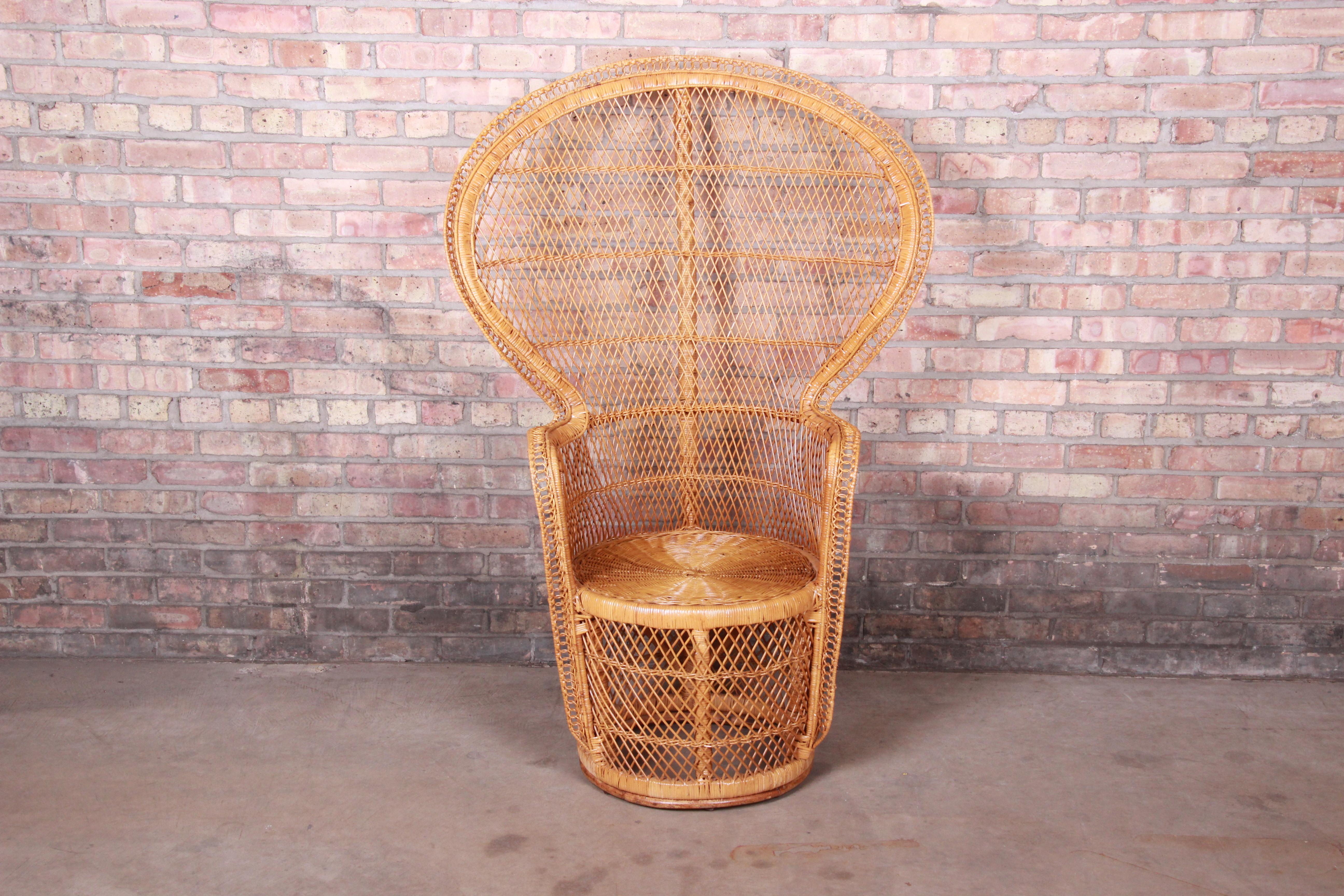 A gorgeous and iconic Mid-Century Modern peacock chair,

circa 1970s

Woven rattan and wicker, with a large scale fan back.

Measures: 36.75