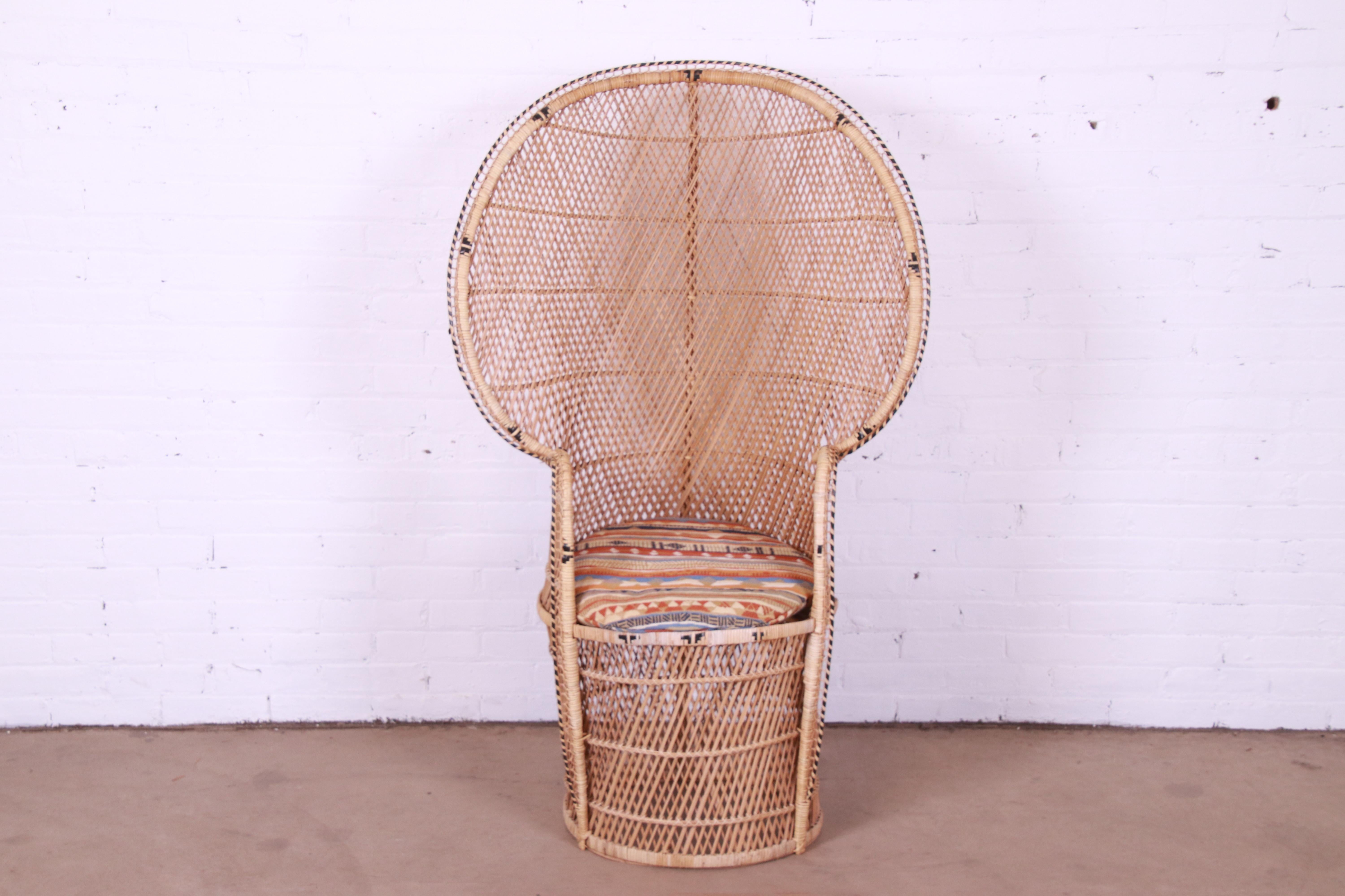 A gorgeous and iconic Mid-Century Modern Bohemian Emanuelle peacock chair.

Circa 1970s

Woven rattan and wicker, with a large scale fan back.

Measures: 32.75