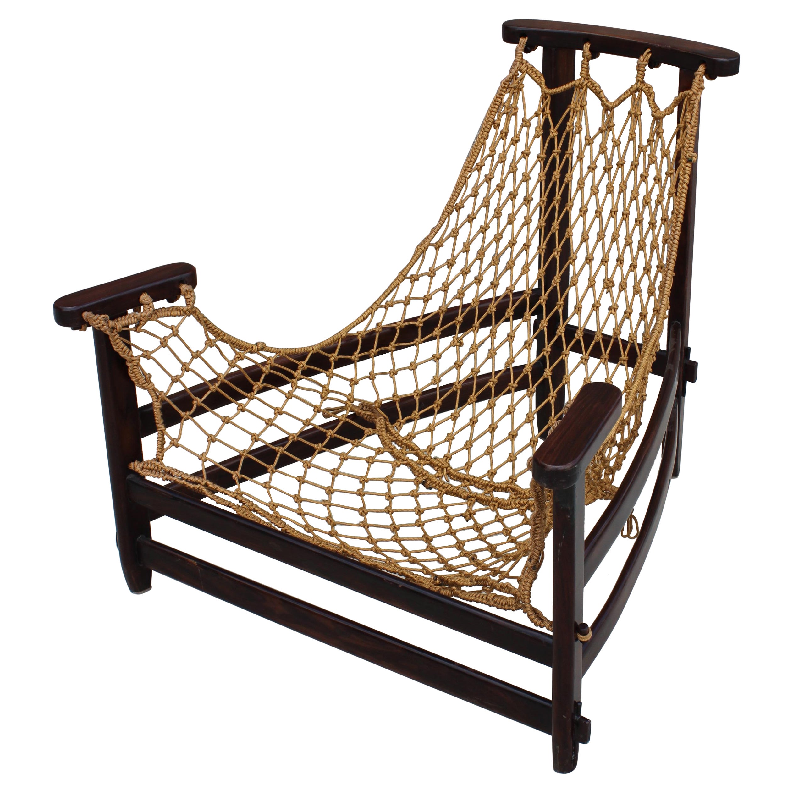 Jean Gillon, 'Jangada' armchair and ottoman, rosewood, nylon rope, cognac leather, Brazil, 1968.

This robust and hefty armchair is designed by Jean Gillon. The originality of this Janganda comes from the concept of the body being captured by the