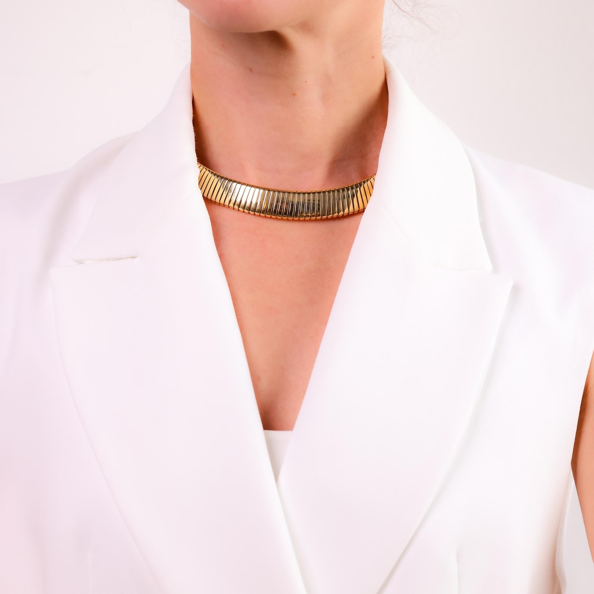 This iconic vintage Bvlgari Tubogas necklace combines luxurious 18k yellow gold and stainless steel in an elegant design with timeless 1970s craftsmanship.

Brand: Bvlgari
Metal: 18k yellow gold and stainless steel
Era: Vintage 
Circa: 1970's