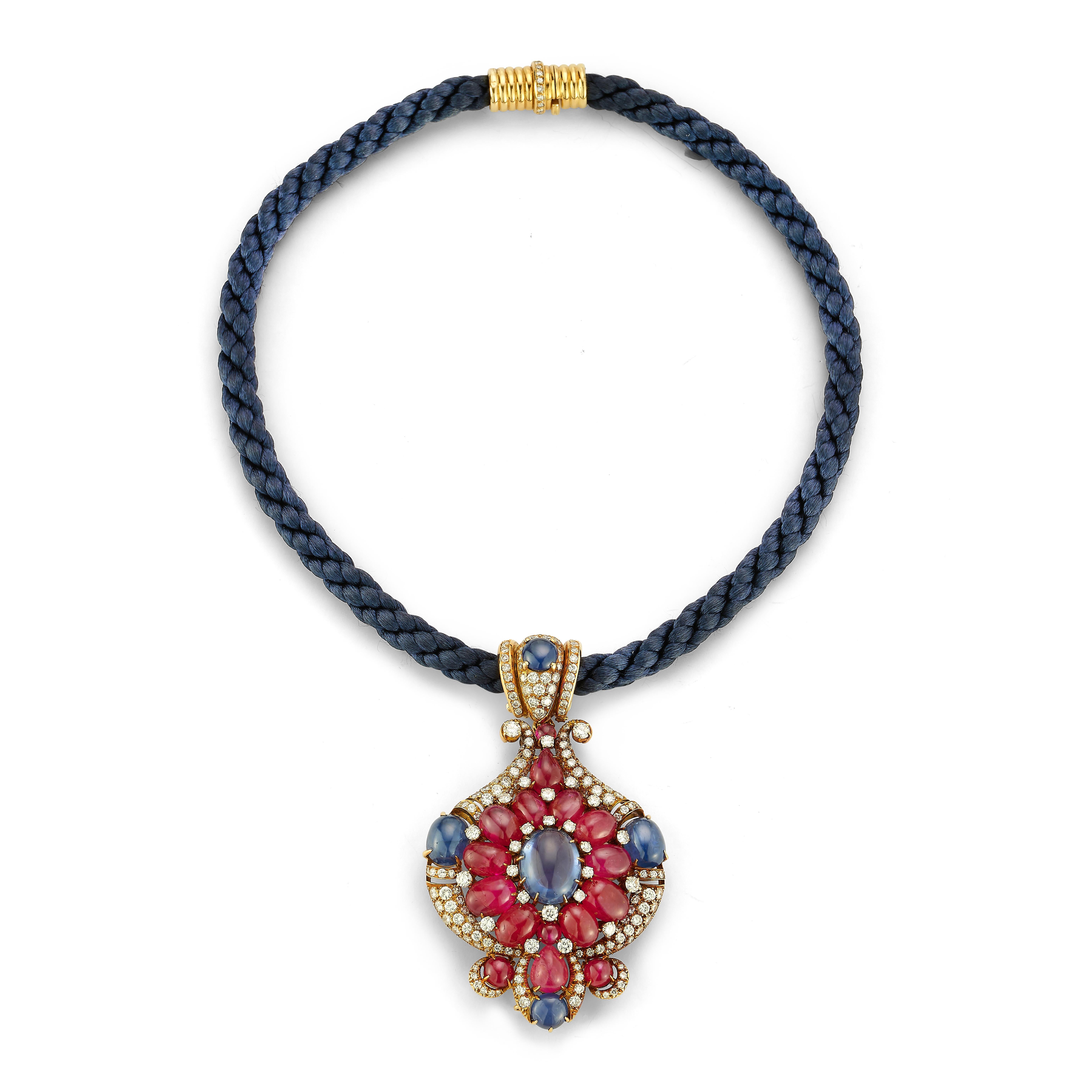 Iconic Bulgari Ruby & Sapphire Pendant Necklace

A very rare necklace featuring certified unheated rubies (Burmese origin) & sapphires (Burmese and Ceylon origin) with round cut diamonds.. The necklace consists of a navy blue rope cord complemented