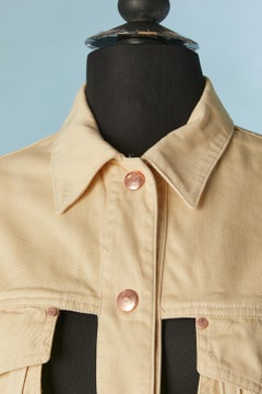 L'iconica giacca "cage" in cotone beige con chiusura a scatto con marchio.  JUNIOR GAULTIER JUNIOR