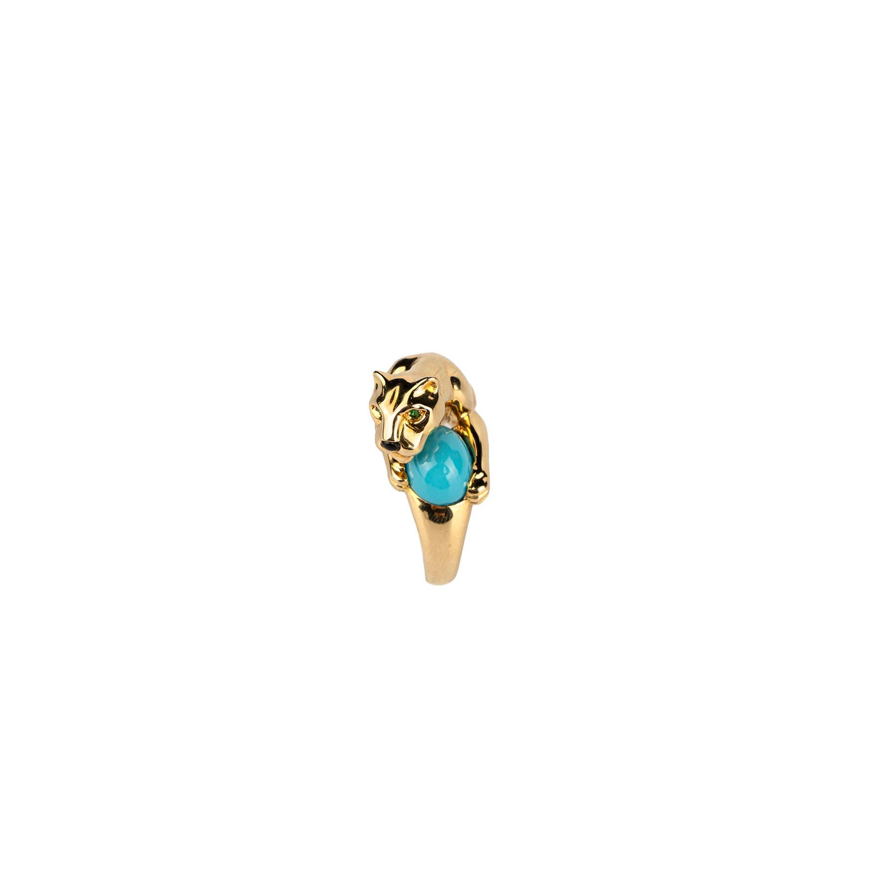 An Iconic Cartier 'Panthère' ring in 18k yellow gold with a turquoise cabochon. Made in France, circa 1990.