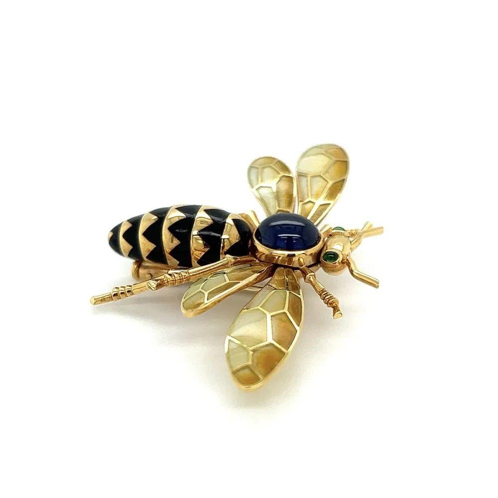 Simply Beautiful! Stylish and finely detailed CARTIER BEE with Plique A Jour Wings Brooch Pin. The Bee is adorned with 1.5 Carats of Sapphires for its wings, Emeralds for its eyes, and Black Enamel for its Body. Measuring 55mm x 35mm. Hand crafted