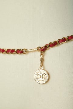 Iconic chain and leather belt with "CC" coin attached Chanel Circa 1980's