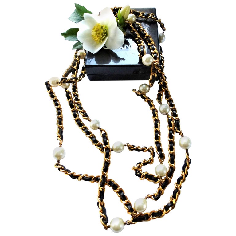 Iconic Chanel chain with leather woven throughout and Chanel pearls ...
