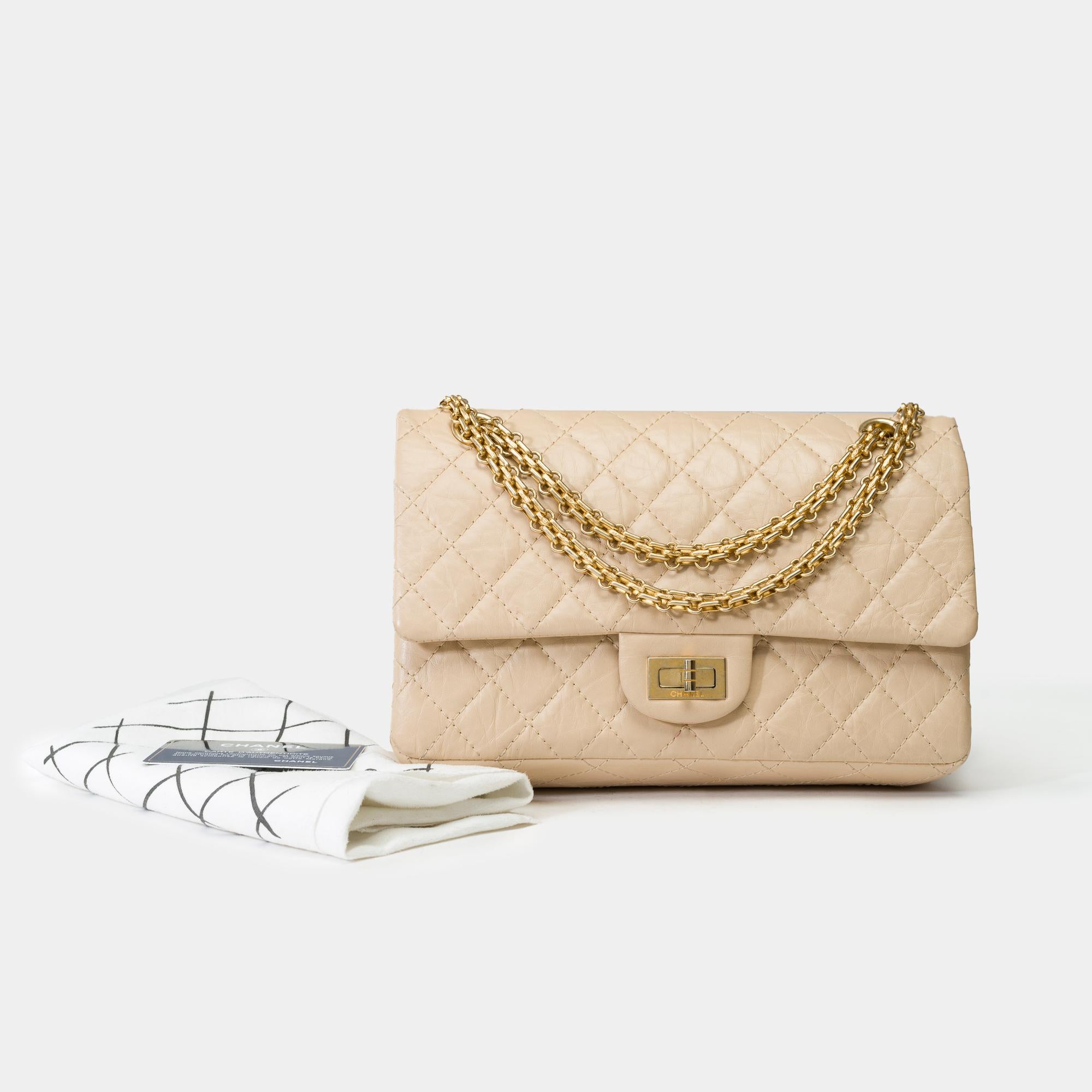 Exceptional​ ​and​ ​Rare​ ​Chanel​ ​double​ ​flap​ ​shoulder​ ​bag​ ​in​ ​aged​ ​beige​ ​quilted​ ​leather,​ ​featuring​ ​aged​ ​gold​ ​metal​ ​hardware,​ ​and​ ​an​ ​aged​ ​gold​ ​metal​ ​chain​ ​handle​ ​that​ ​allows​ ​for​ ​hand​ ​or​ ​shoulder​