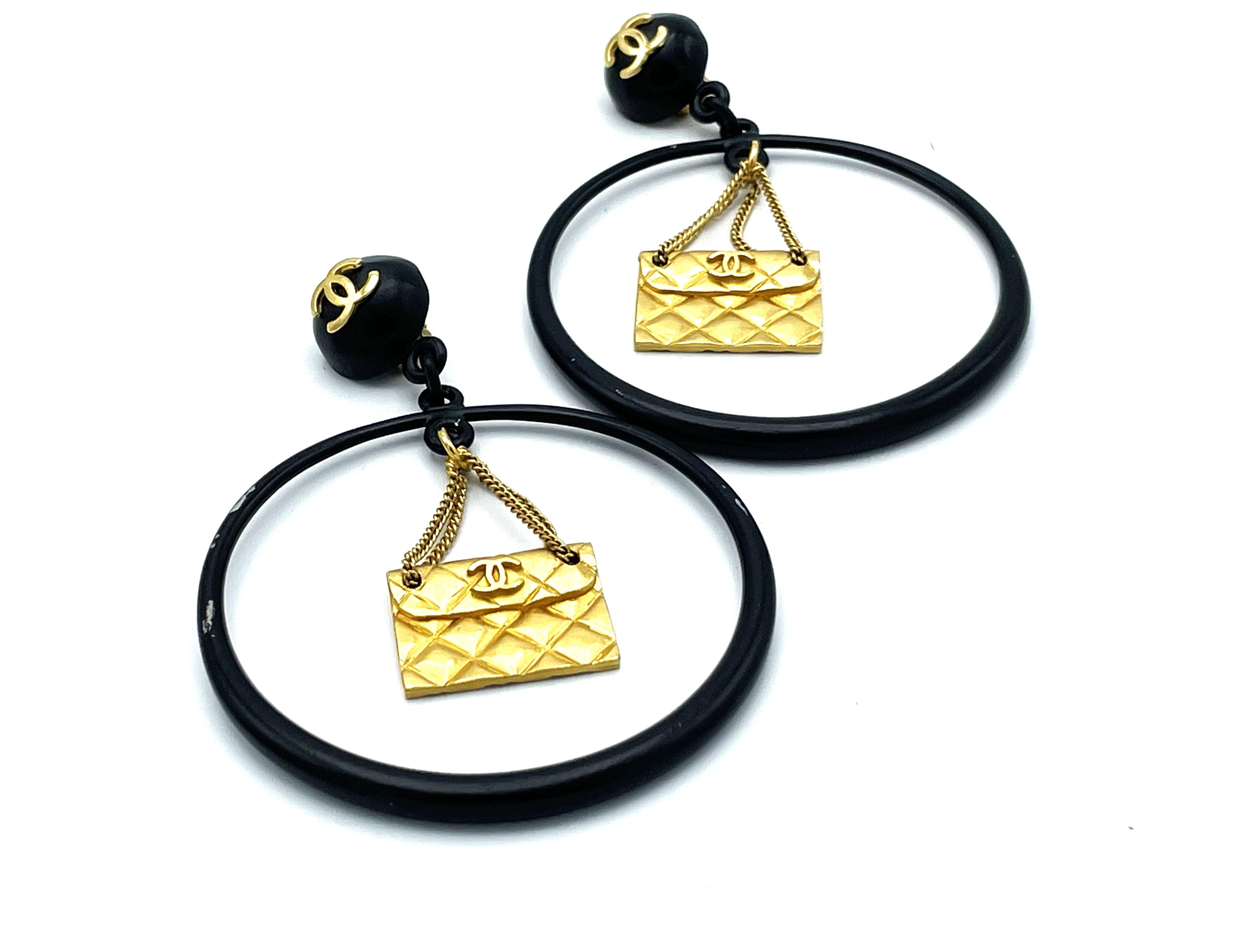 Iconic Chanel black Circle clip-on earring with gold Chanel bag hanging, 1990s For Sale 2