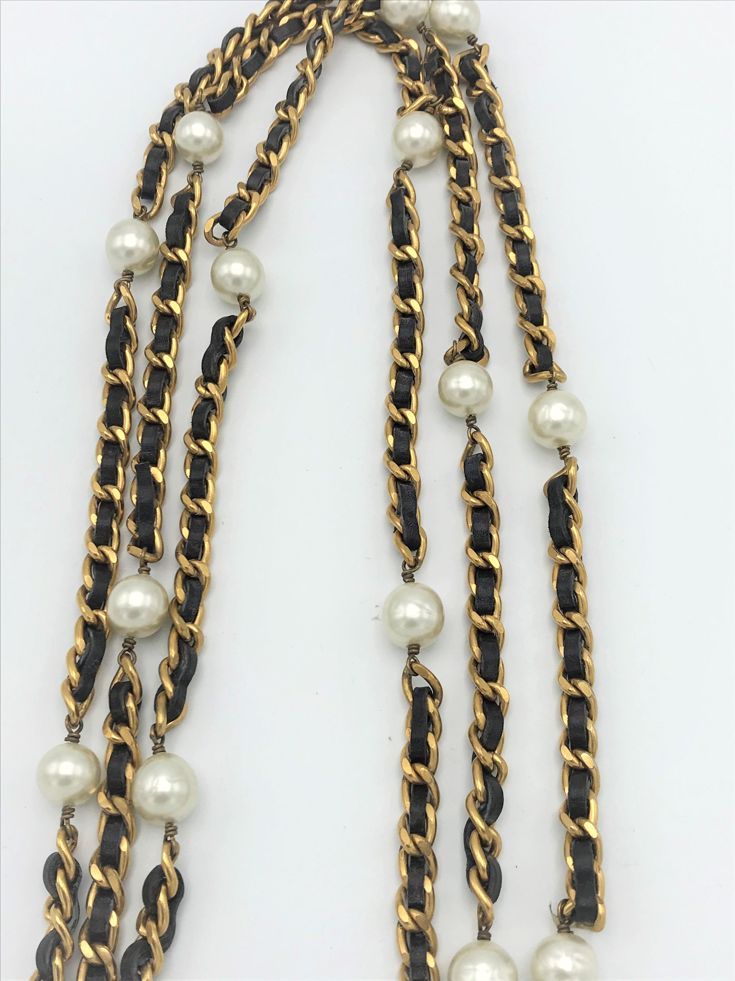 Round Cut Iconic Chanel chain with leather woven throughout and Chanel pearls, 1990s