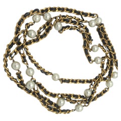 Iconic Chanel chain with leather woven throughout and Chanel pearls, 1990s