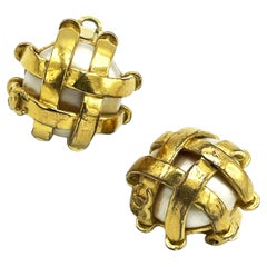 ICONIC CHANEL CLIP-ON EARRING,  pearl quilted with gold ribbons, signed 93 P