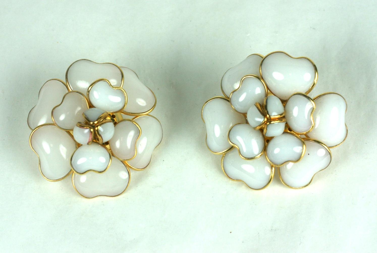 Classic, Iconic Chanel Maison Gripoix white opal signature camelia poured glass ear clips. The handmade petals naturally and dimensionally layered.  Settings of hand made gilt bronze with hand poured glass. Clip back fittings.
Chanel no longer uses