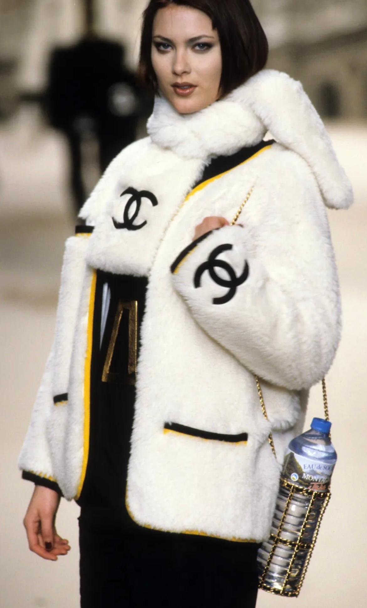 An extremely rare Chanel water bottle holder from the Fall 1994 collection. Must have for a real collector!  This exceptional piece made of gold-plated brass and leather was featured by Claudia Schiffer, Brandi Quinones, Rihanna and Amber in the