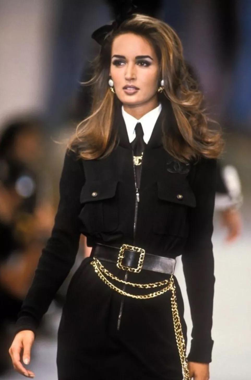 This iconic black dress from the Chanel Spring/Summer 1992 collection epitomizes Karl Lagerfeld's distinctive style. For an uber-cool look, pair it with a cropped white shirt underneath, a chunky waist belt, and black sunglasses. The dress features
