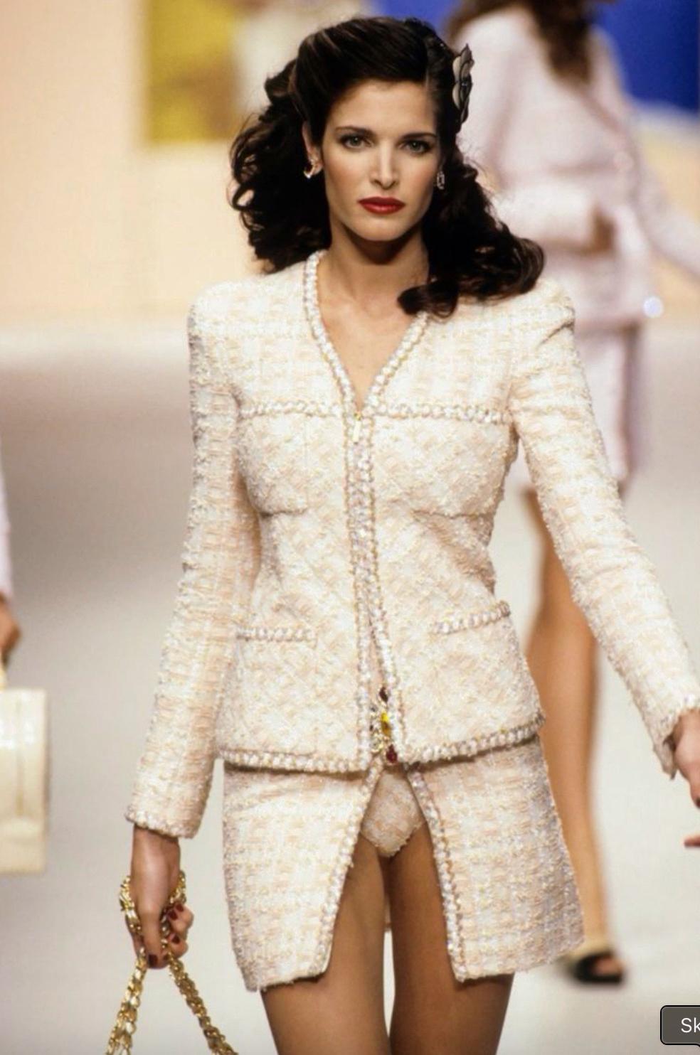 The most wanted and exceptionally rare Chanel Barbie suit from the iconic Spring 1995 collection. This breathtaking ensemble, designed by Karl Lagerfeld, was famously worn by supermodel Stephanie Seymour on the runway and has been seen in variations