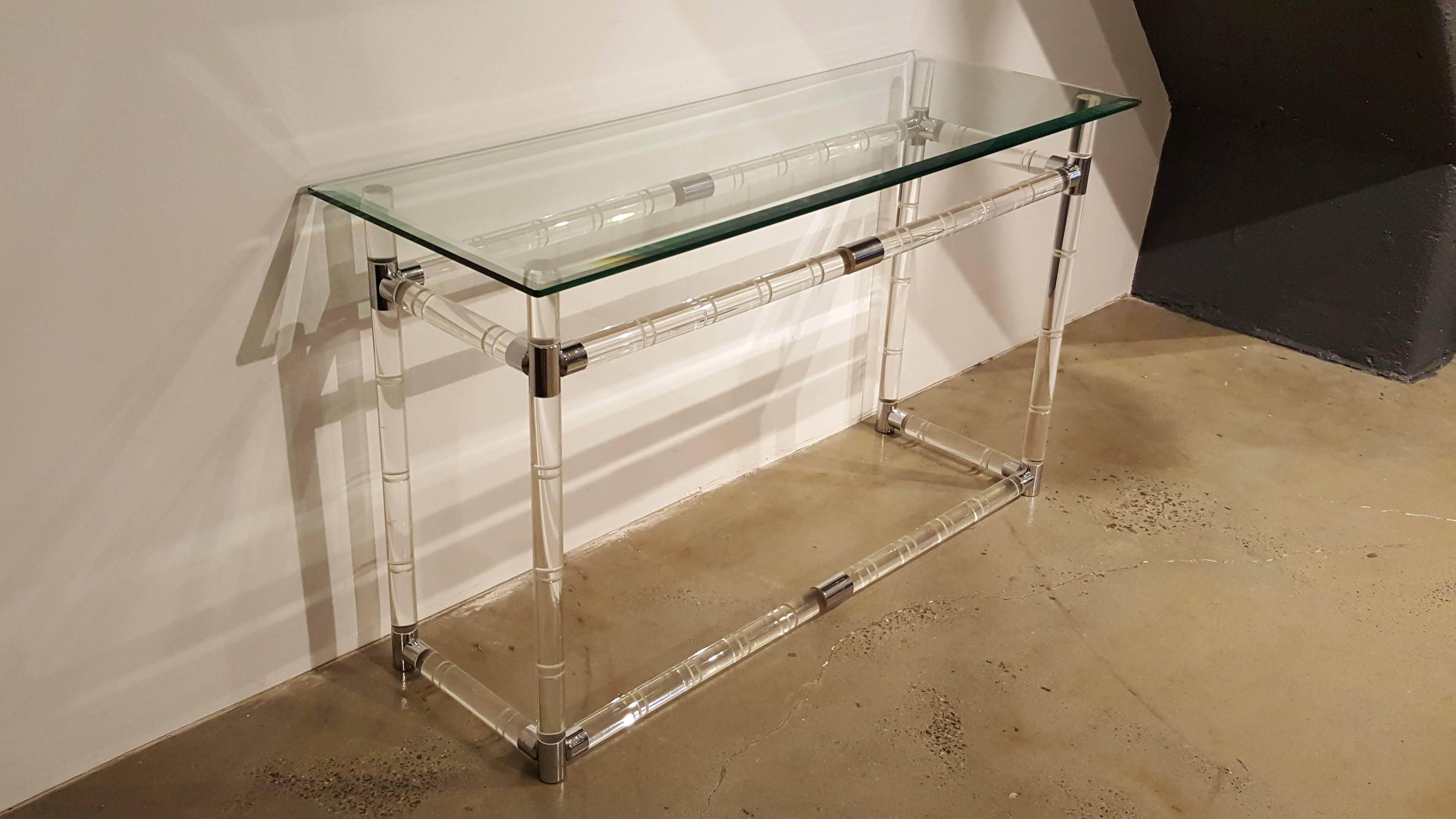 Striking console table in Lucite, glass and chrome or polished nickel from the iconic Bamboo series by Charles Hollis Jones. Gorgeous design and a classic example of his work. Bevelled glass top is 18