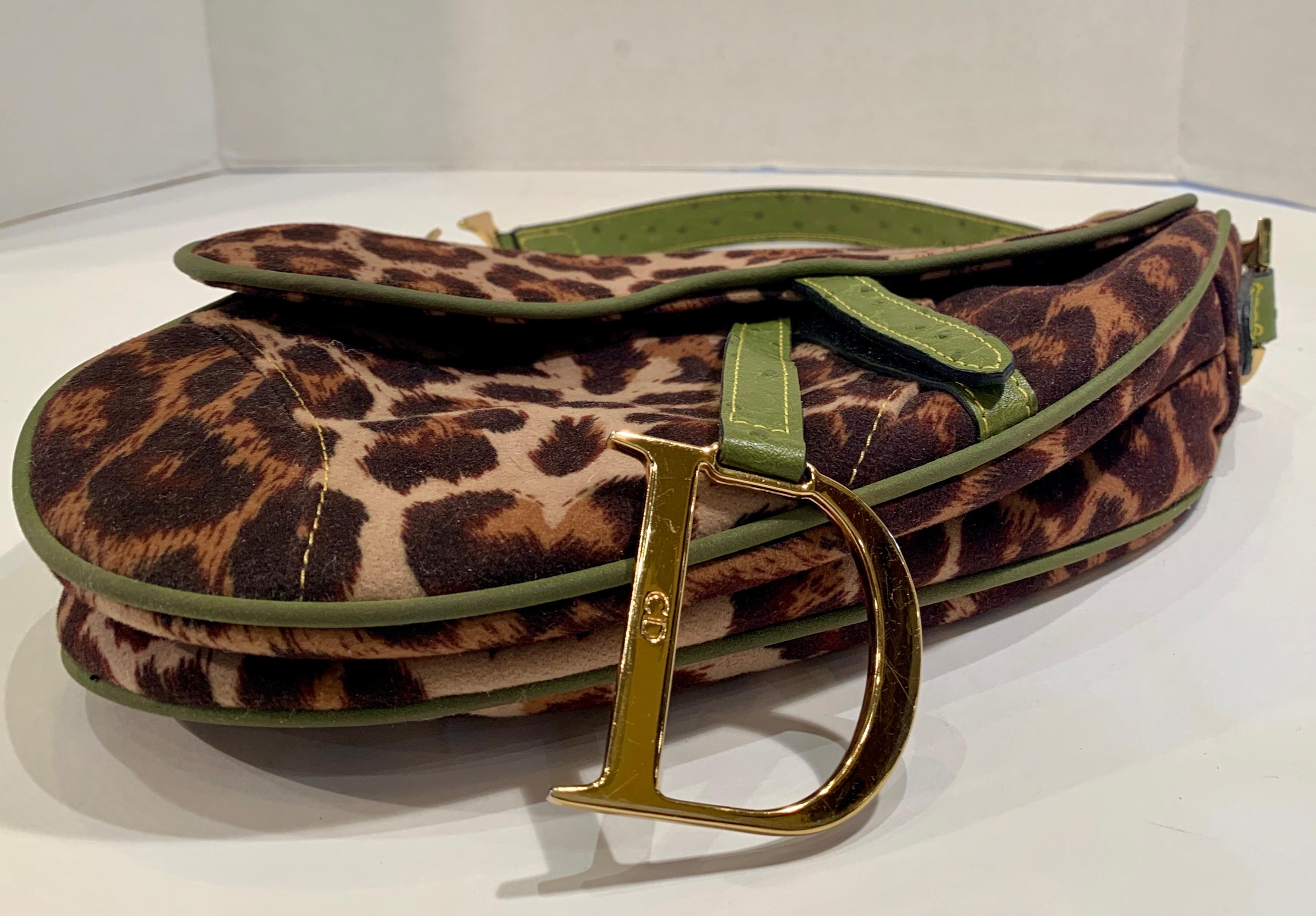 Bold and whimsical leopard print fabric saddle bag with oversized gold-tone logo 