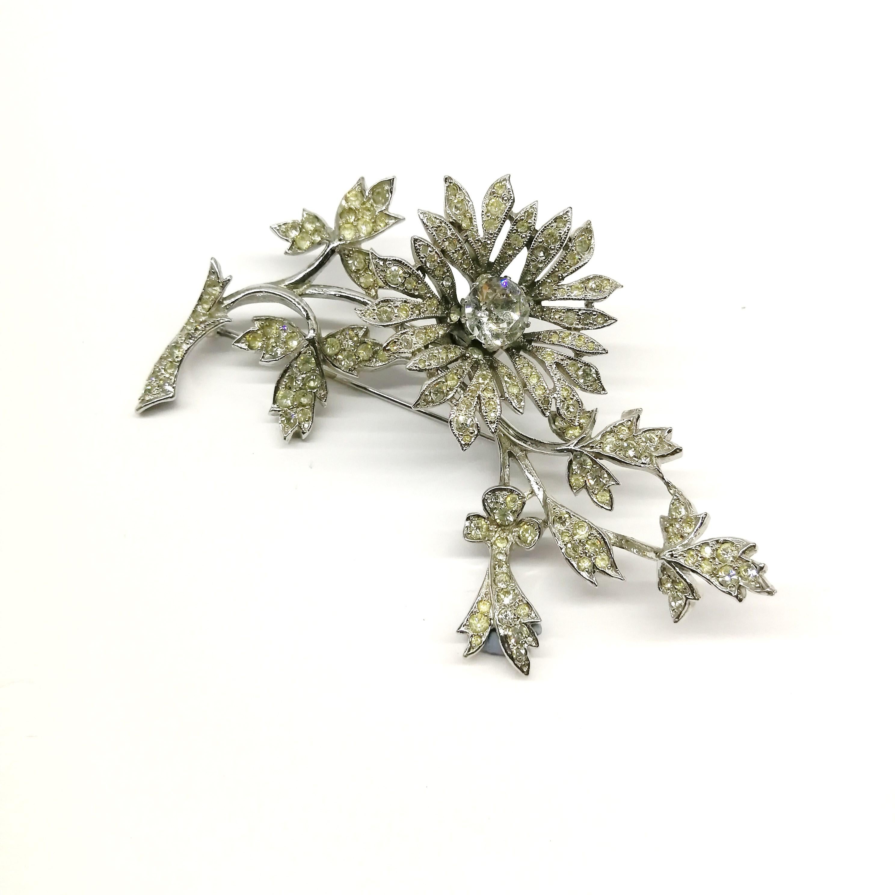 A wonderful and very rare base metal and clear paste 'en tremblant' brooch, made by Mitchel Maer for Christian Dior. Designed at the height of Dior's powers and highly representative of his vision during the early 1950s, when he was looking back to