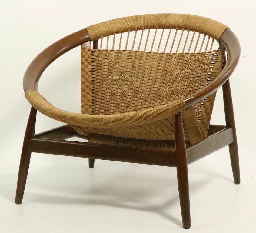 Truly a midcentury Danish modern classic, the Ringstol chair is stylish, comfortable, and chic. Woven seat and backrest on solid teak frame. This example is in very good, original condition, showing only light cosmetic wear, normal and consistent
