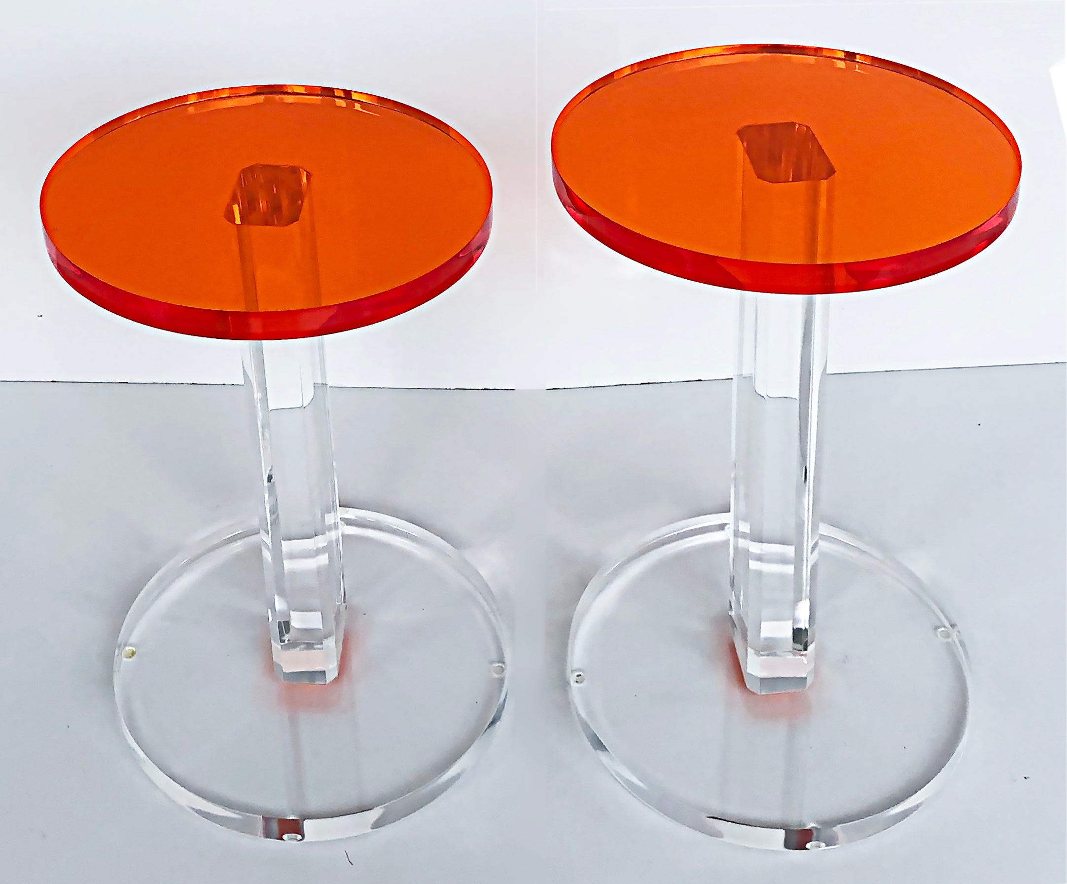 Iconic Design Gallery Custom-Made Lucite Side Tables, Pair

Offered for sale is one of our original custom-made side tables in orange and clear lucite. The tables are slightly different sizes with the height of the lower table is 20.13