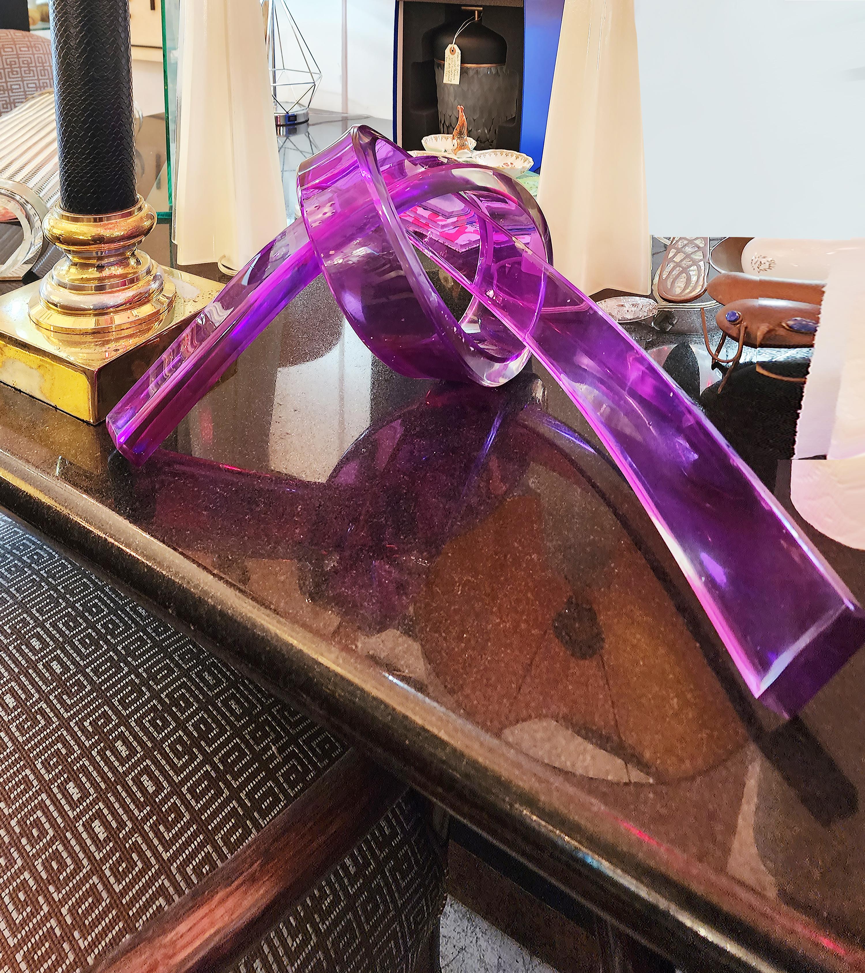 Iconic Design Thick Twisted Abstract Lucite Ribbon Sculpture

Offered for sale is an iconic design thick, twisted purple lucite ribbon sculpture.
Lucite is bi-color clear and purple and 1