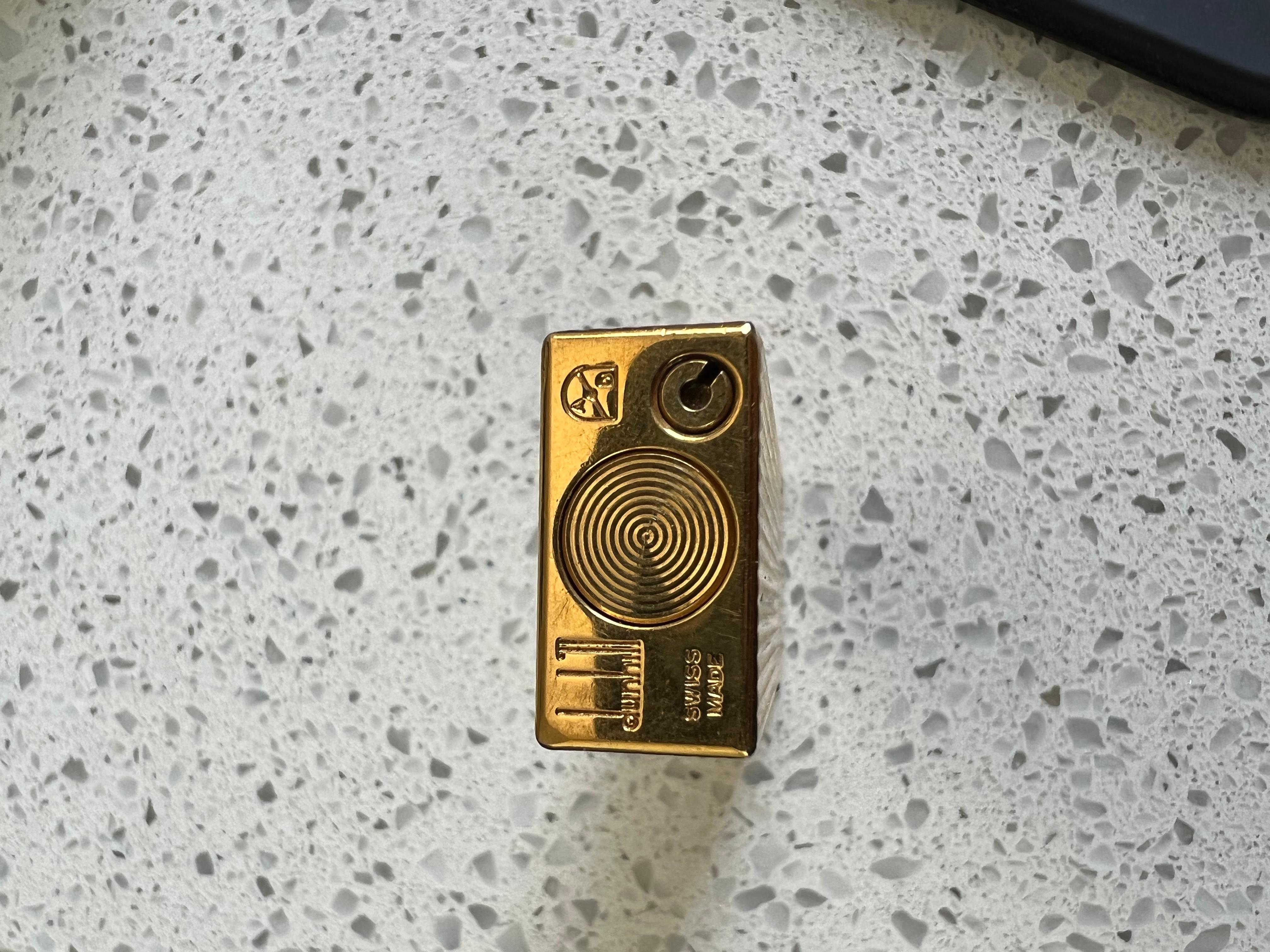 Iconic Dunhill Gold-Plated Cigarette Lighter with Original Red Lather Case In Excellent Condition For Sale In New York, NY