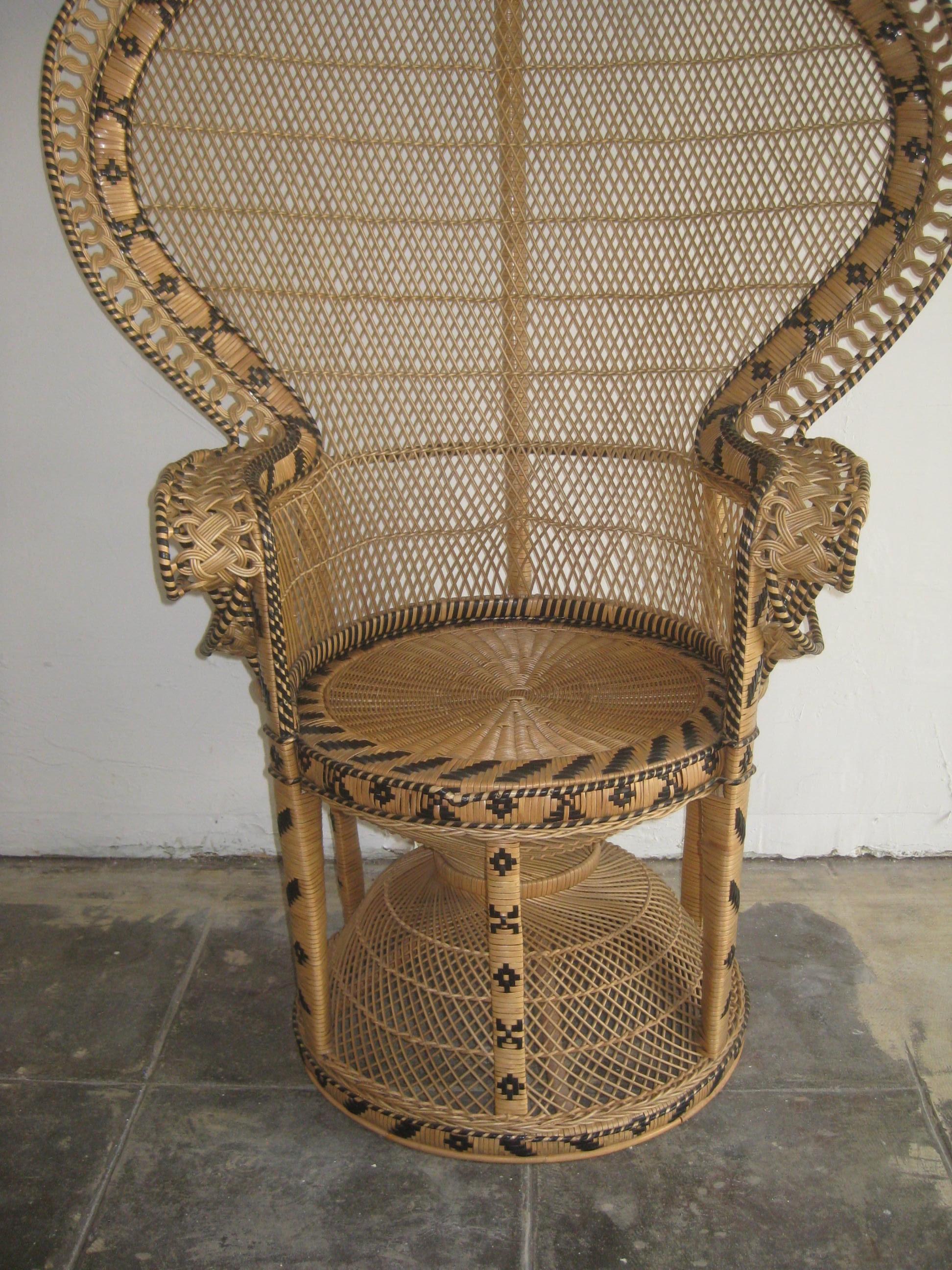 Iconic Emmanuelle wicker and rattan midcentury peacock chair. This chair is a statement piece and in mint condition. It has no broken, no brittle or repaired pieces. Displays well and is very strong. The color is awesome and would work in any