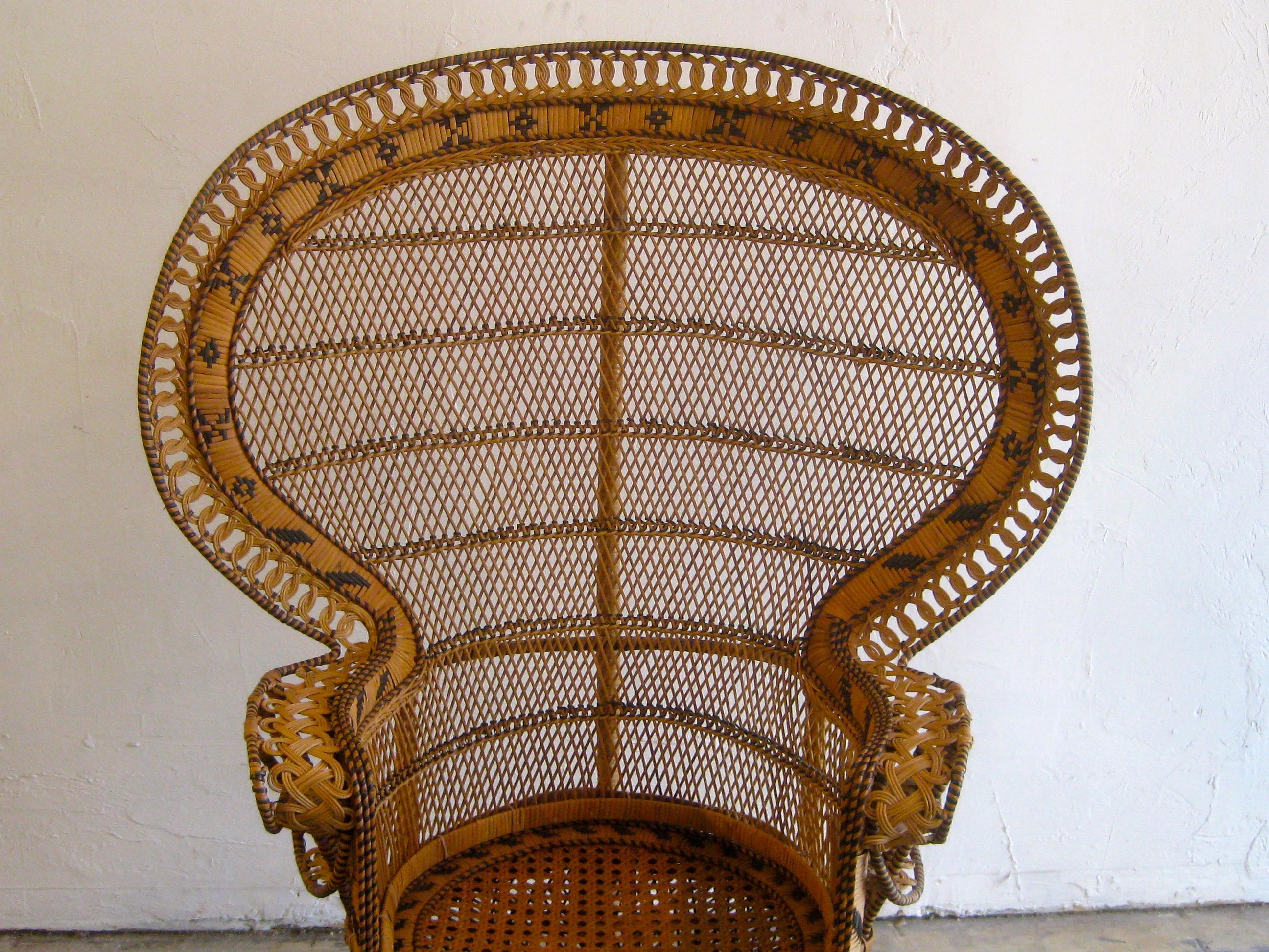 Iconic Emmanuelle wicker and rattan midcentury peacock chair. This chair is a statement piece and in excellent original condition. It has no broken, no brittle or repaired pieces. Displays well and is very strong. The color is awesome and would work