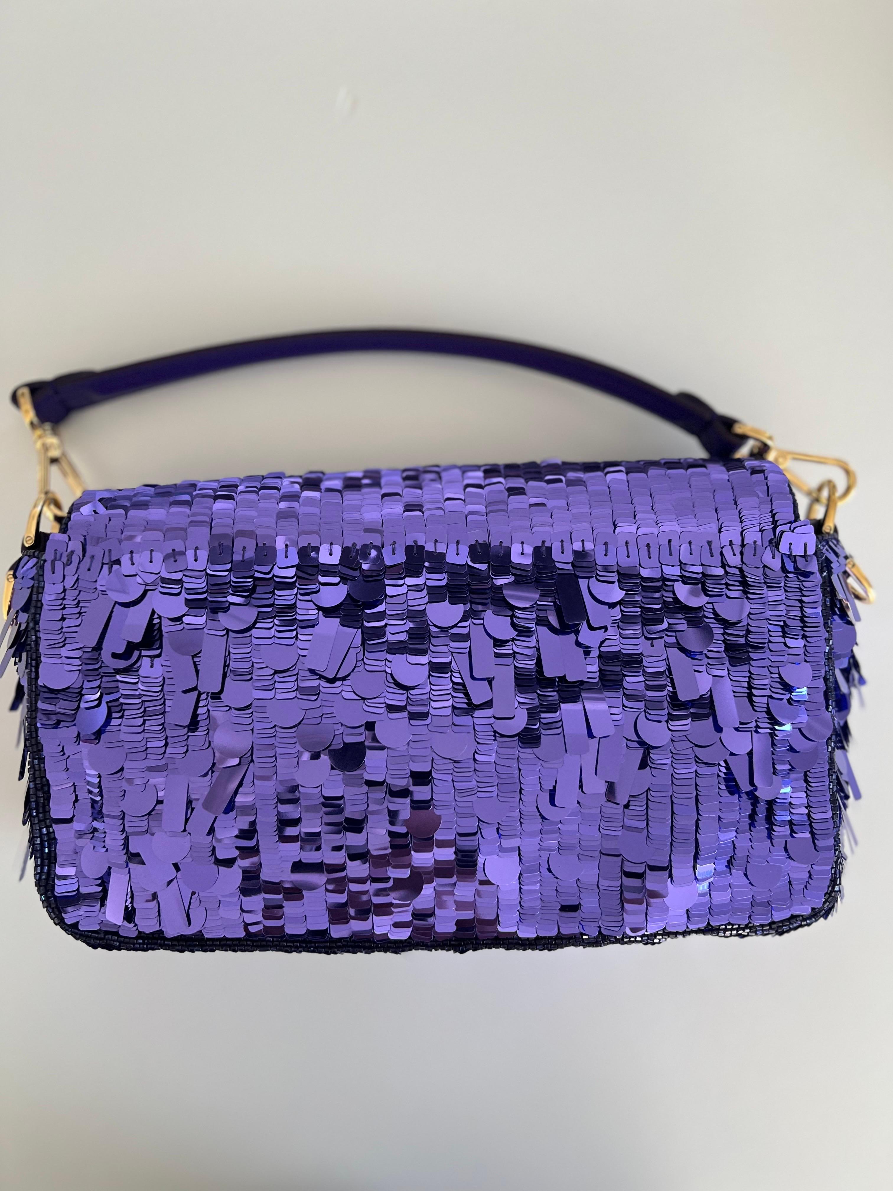 Step into the spotlight with the iconic Fendi 1997 Re-Edition Purple Sequin Baguette. Originally launched in 1997, this reimagined classic captures the essence of Fendi's timeless style with a modern twist.

Adorned with shimmering purple sequins,