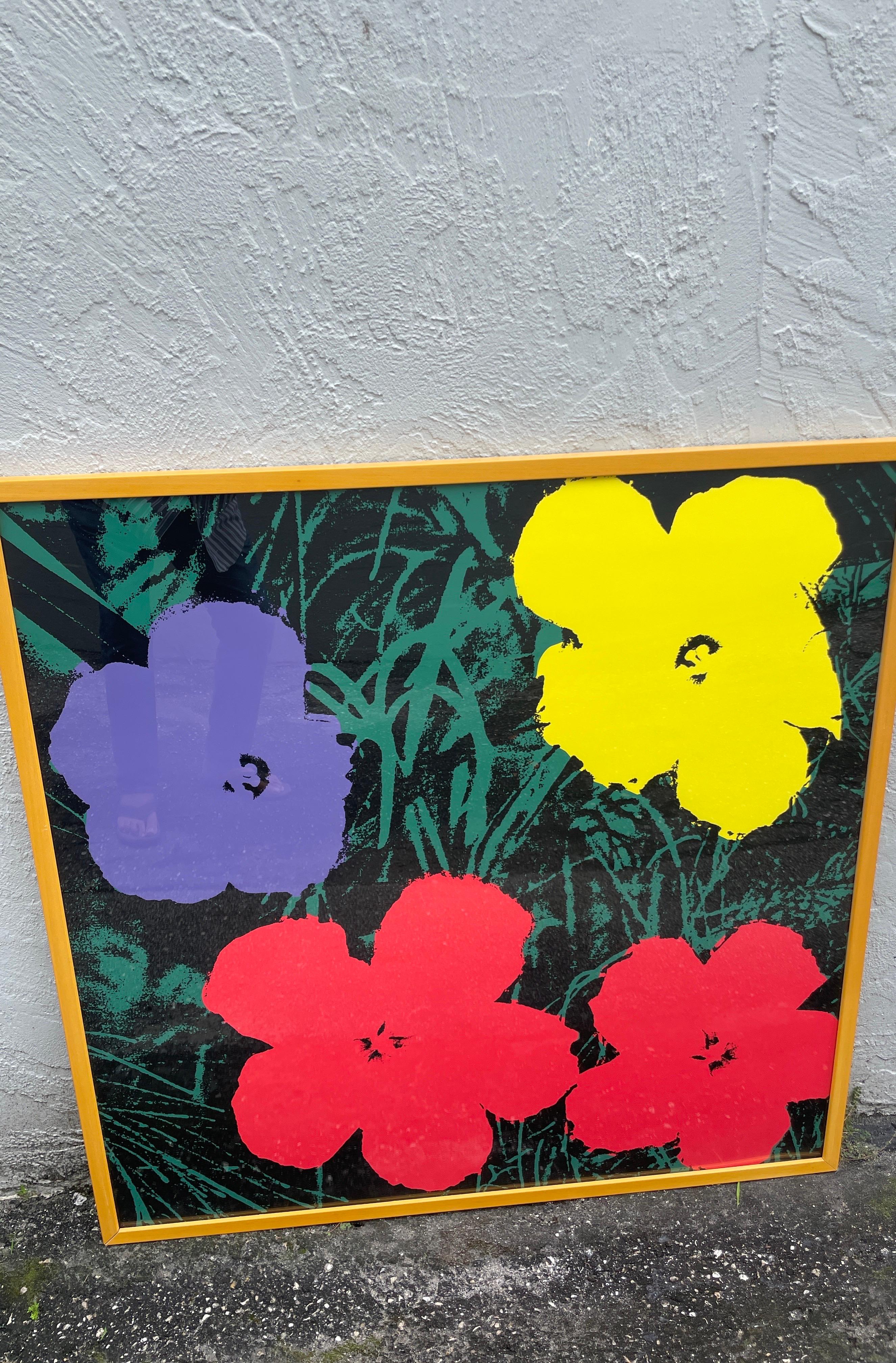 Serigraph from The Iconic Flower Series by Andy Warhol. A wonderful example with vibrant colors in a wood frame.
