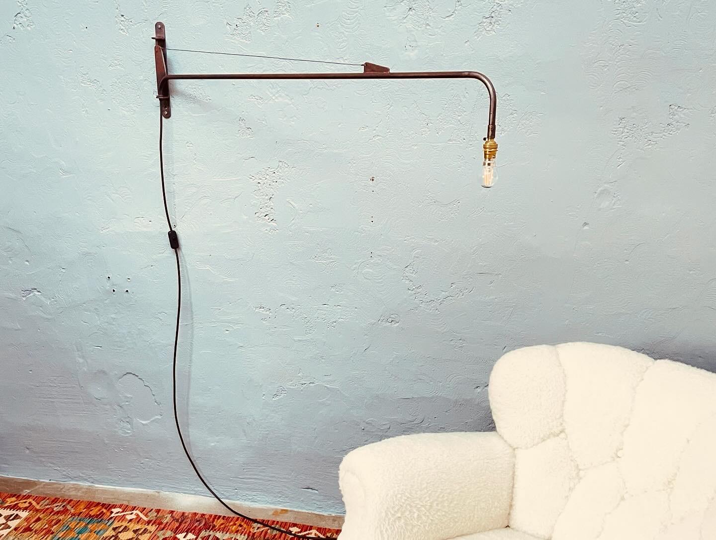 Iconic French industrial work lamp by Jean Prouve. 
With a beautiful dark age related wear and patina to the surfaces. 
Still with traces of the original paint. 
Rewired and fitted with an inline on/off switch. 
Still maintained the original brass