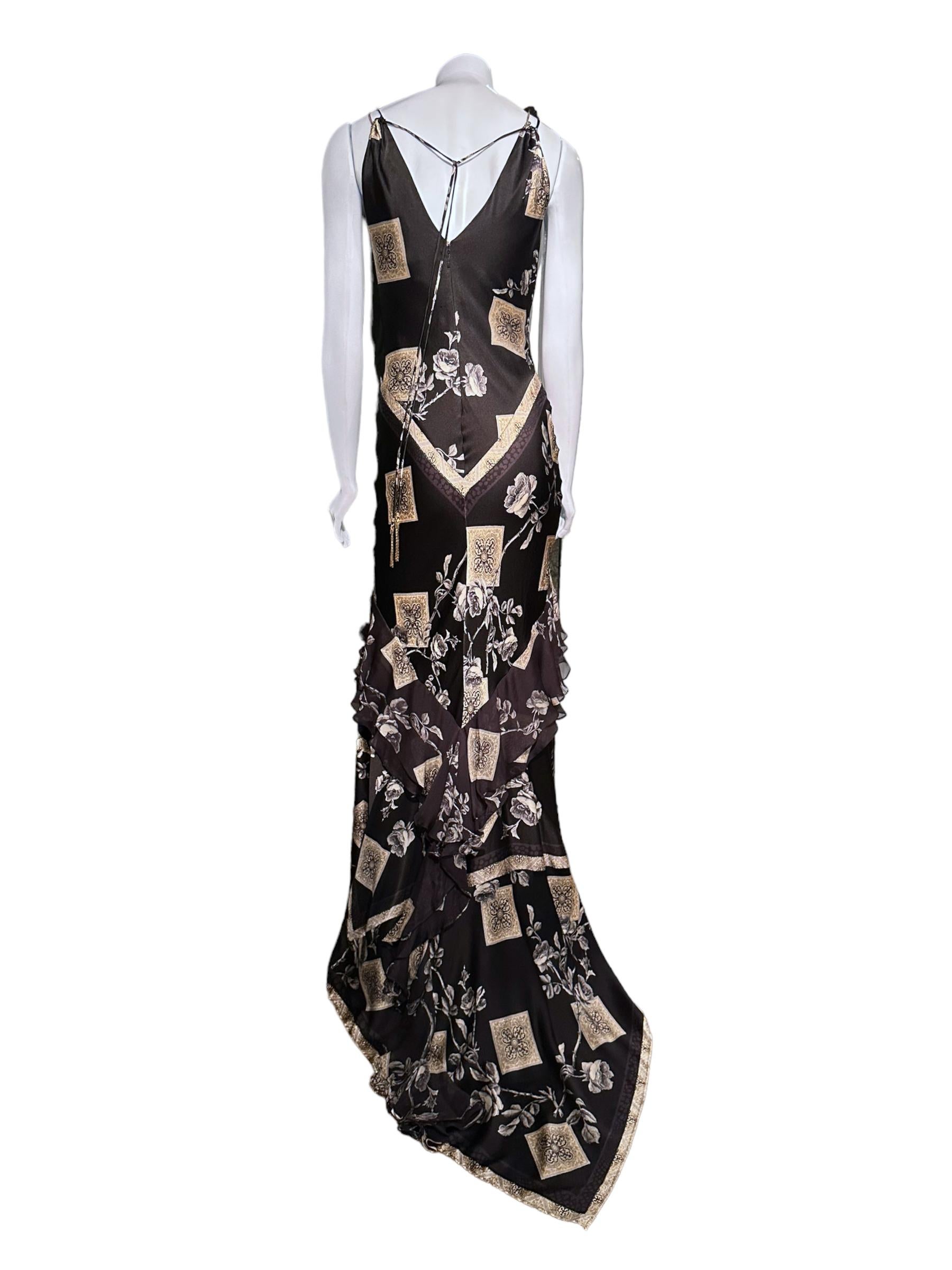 
Bias cut silk
Dramatic but functional train
Signature Cavalli glittery silk fabric 
V-neckline
Adjustable with tie-up straps - hardware charms at the end
Zip-up back (invisible)
long handkerchief style train
Ruffle details

Pre-owned vintage