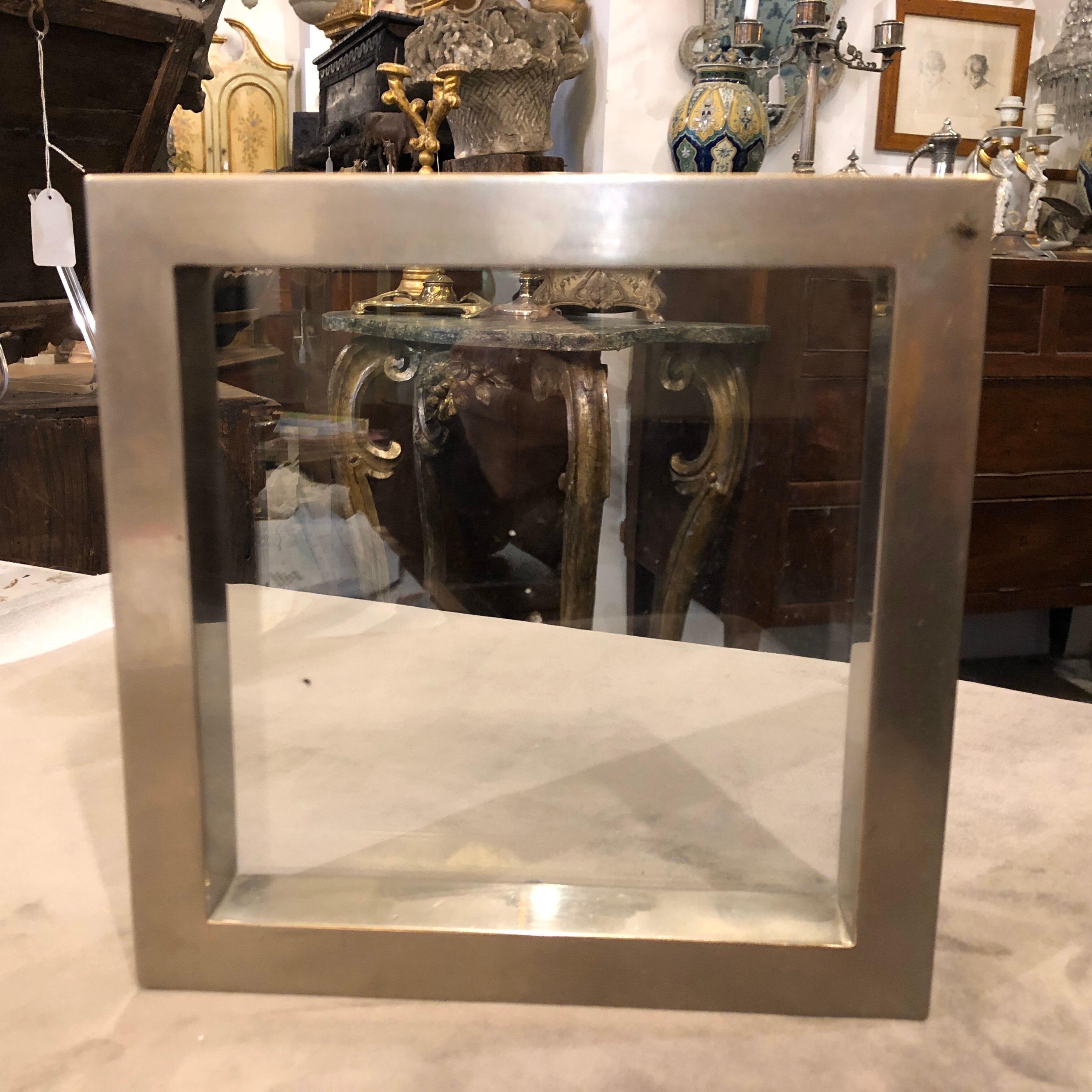 A rare metal ashtray, also usable as a picture frame, signed by Gabriella Crespi, an illustrious Italian designer. The ashtray consists of a metal square and two glass plates. The two plates are screwed into the metal, and it is signed by Gabriella