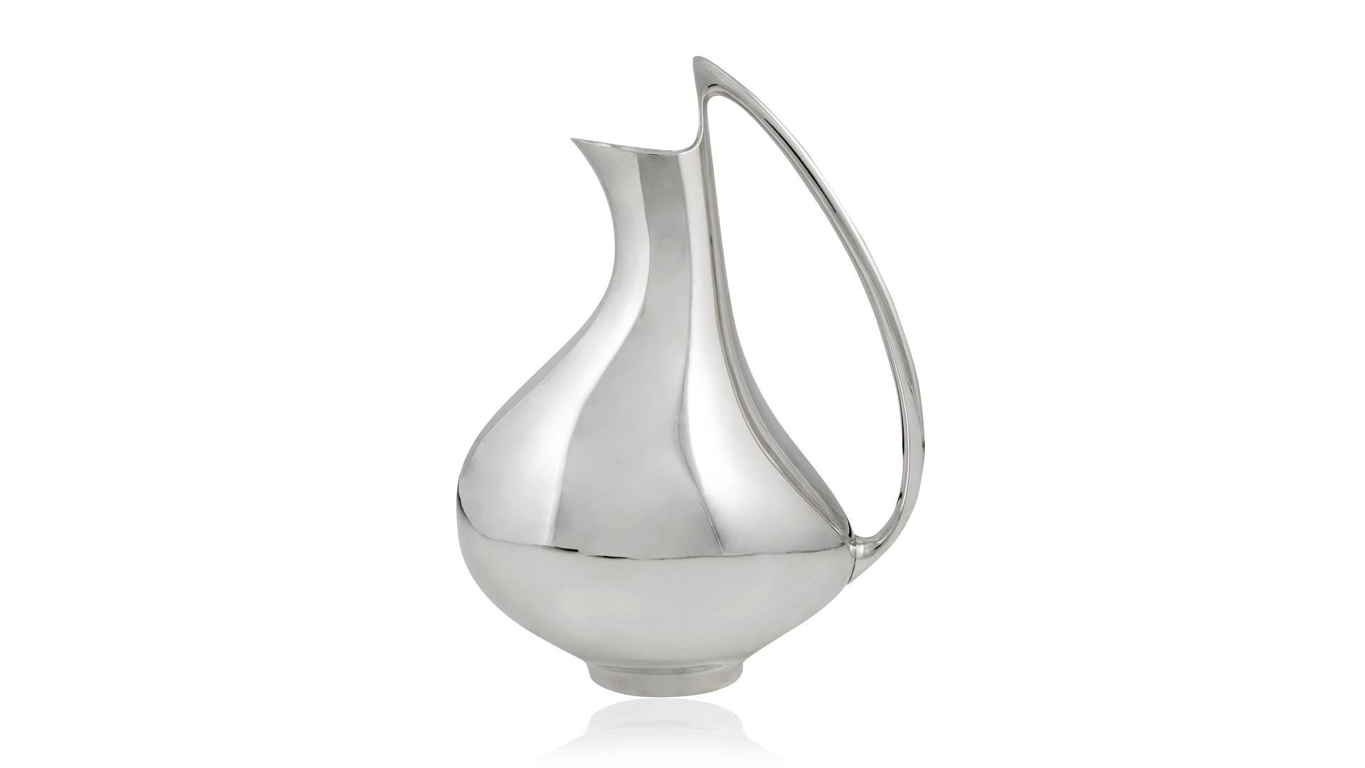 A Modern sterling silver Georg Jensen pitcher, design #992 by Henning Koppel from 1952, known as the 