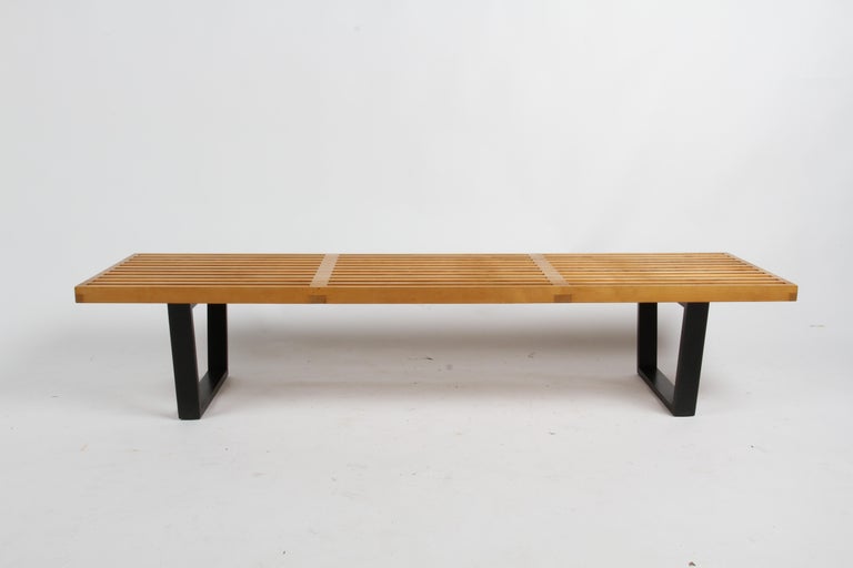 A true Mid-Century Modern classic, this timeless c. 1960s model #4691 slat bench designed by George Nelson for Herman Miller has that sought after warm patina to the maple slats on ebonized legs. Marked in wax pen to underside, 264/4691 and Nat/Blk,