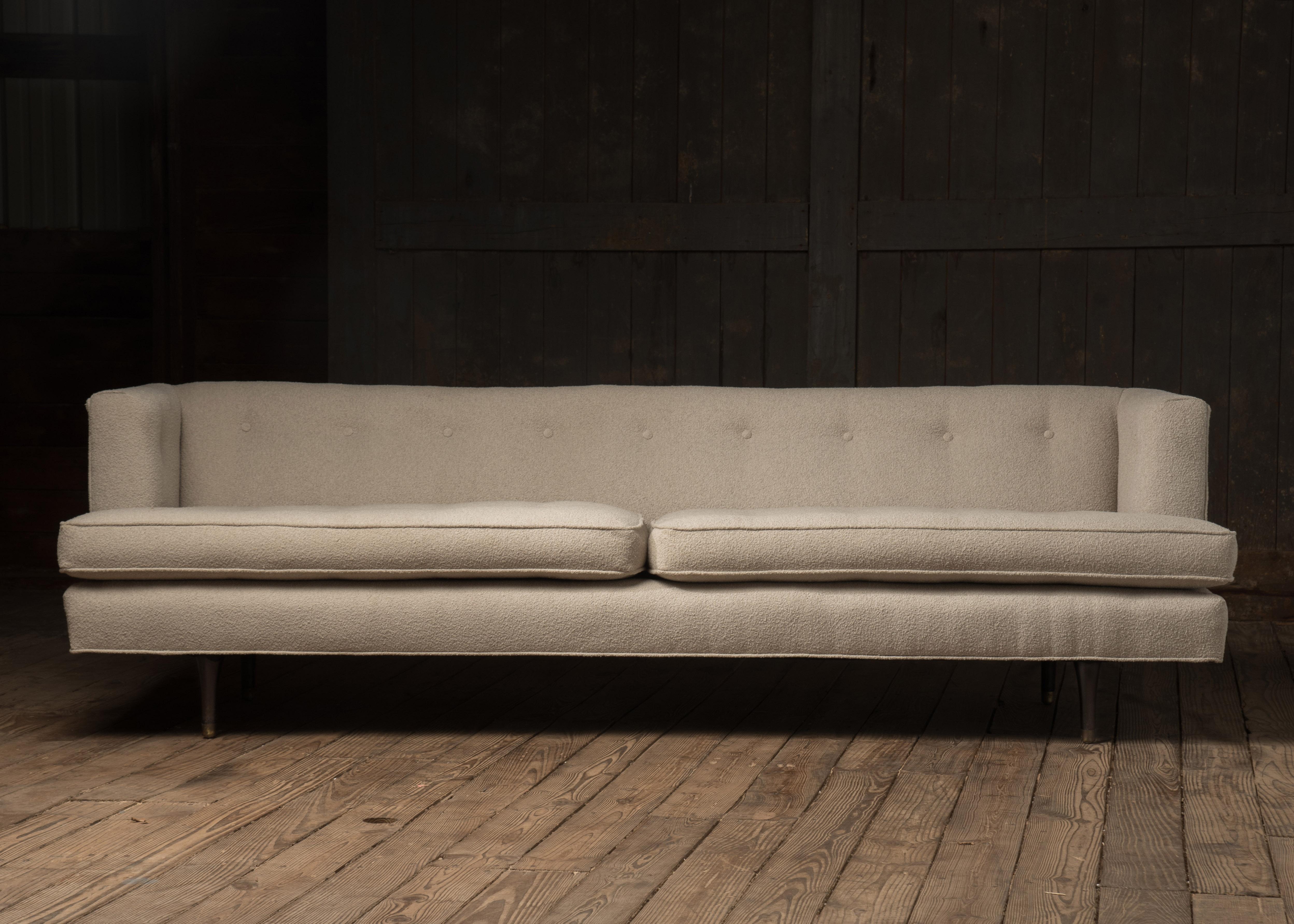 Iconic sleek and sexy Dunbar midcentury modern sofa by Edward Wormley, just reupholstered in an appropriate to the style nubby off-white fabric.
Measures: Seat height 18.5.