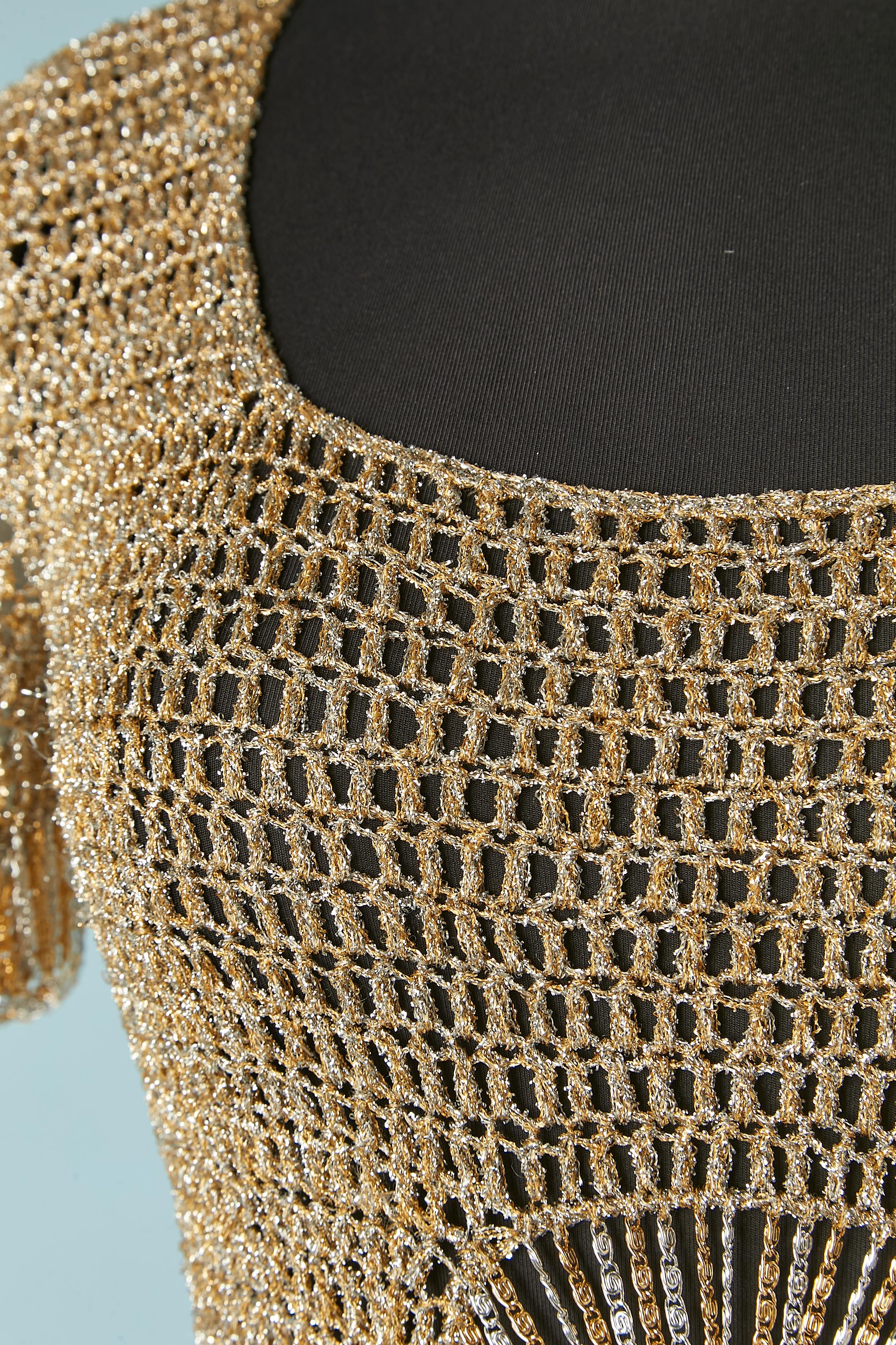 Iconic gold and silver lurex knit sweater with metallic chains. One snap closure in the top middle back. 
NO BRAND TAG
SIZE 34 (Fr) XS 