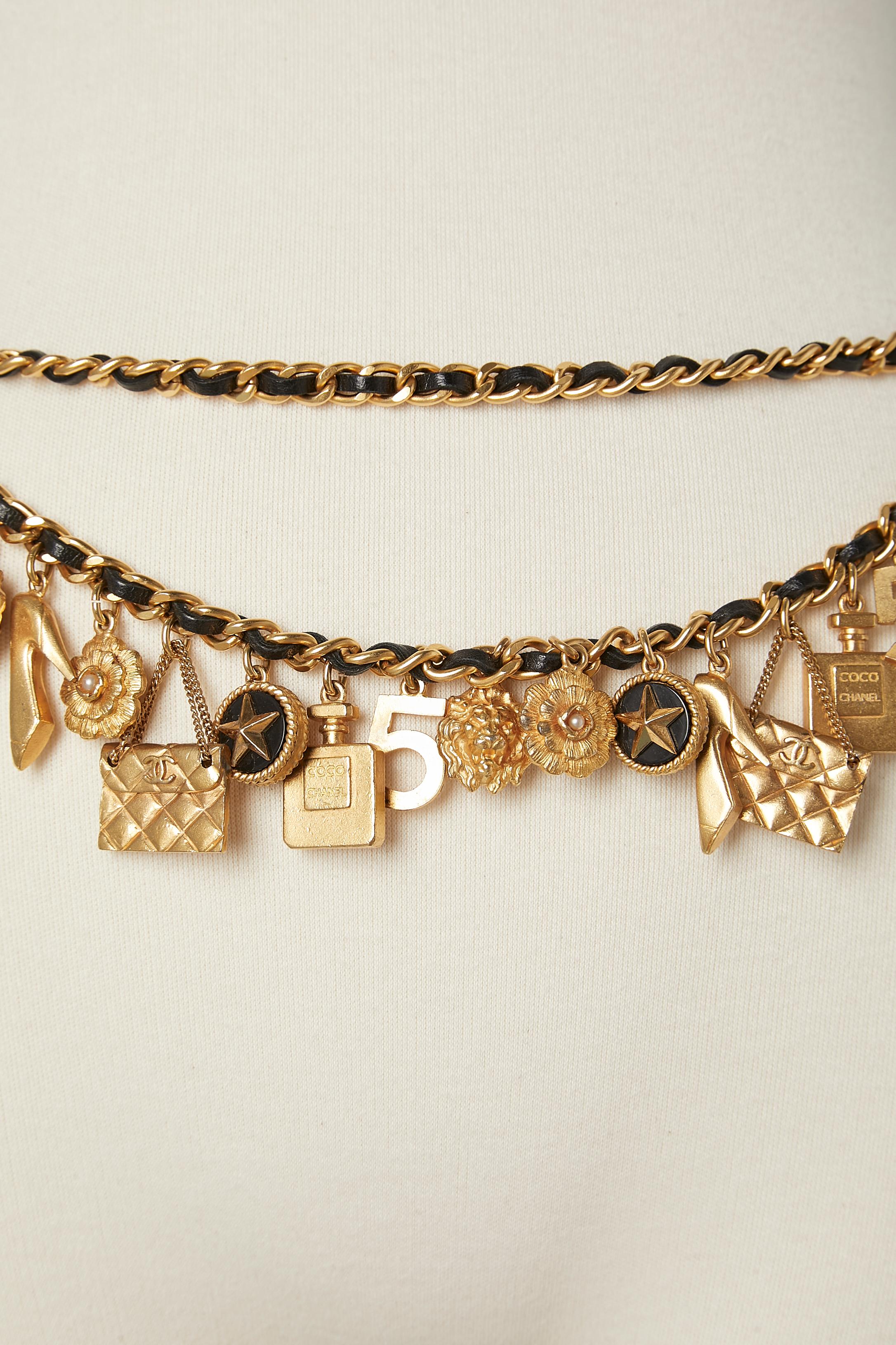 Iconic gold metal charm's on chain and black leather belt  Chanel Circa 1990's  1