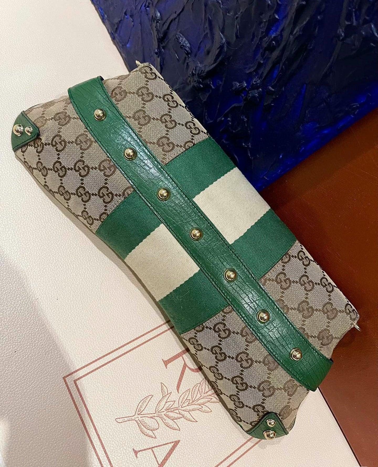 Iconic Gucci Horsebit 1955 Chain Cloth Gucci Monogram Green Leather and Gold Studs
 These are professional photos of the actual bag offered by Luxbags.
 Make a statement with this large Gucci shoulderbag. Crafted from iconic Gucci monogram in beige