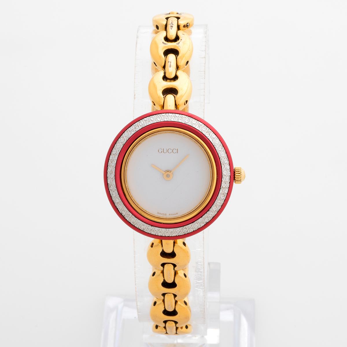 Our neo vintage and iconic Gucci ladies reference 11/12.2 a reference which supersedes the reference first launched as 1200L features a gold plated case and bracelet with interchangeable bezels. One of the most popular Gucci watches in period is