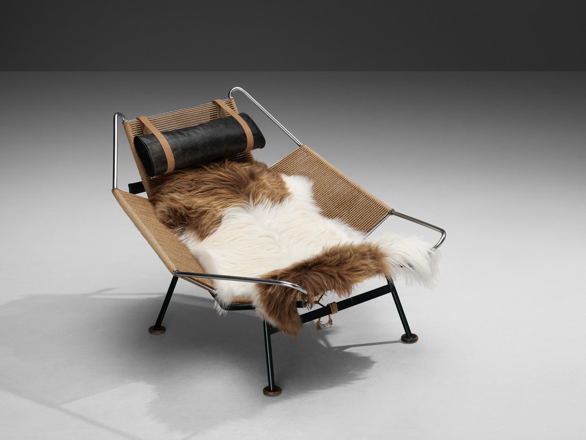 Hans J. Wegner, ‘Flag Halyard’ lounge chair model ‘GE225’, rope, steel, dark green lacquered steel, leather, wood, sheepskin, Denmark, 1958

This iconic chair, made with 250 metres of rope, is designed by the Danish designer Hans Wegner. The name