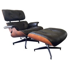 Silla y otomana icónicas Herman Miller Eames Rosewood Lounge Chair, Model 670 & 671