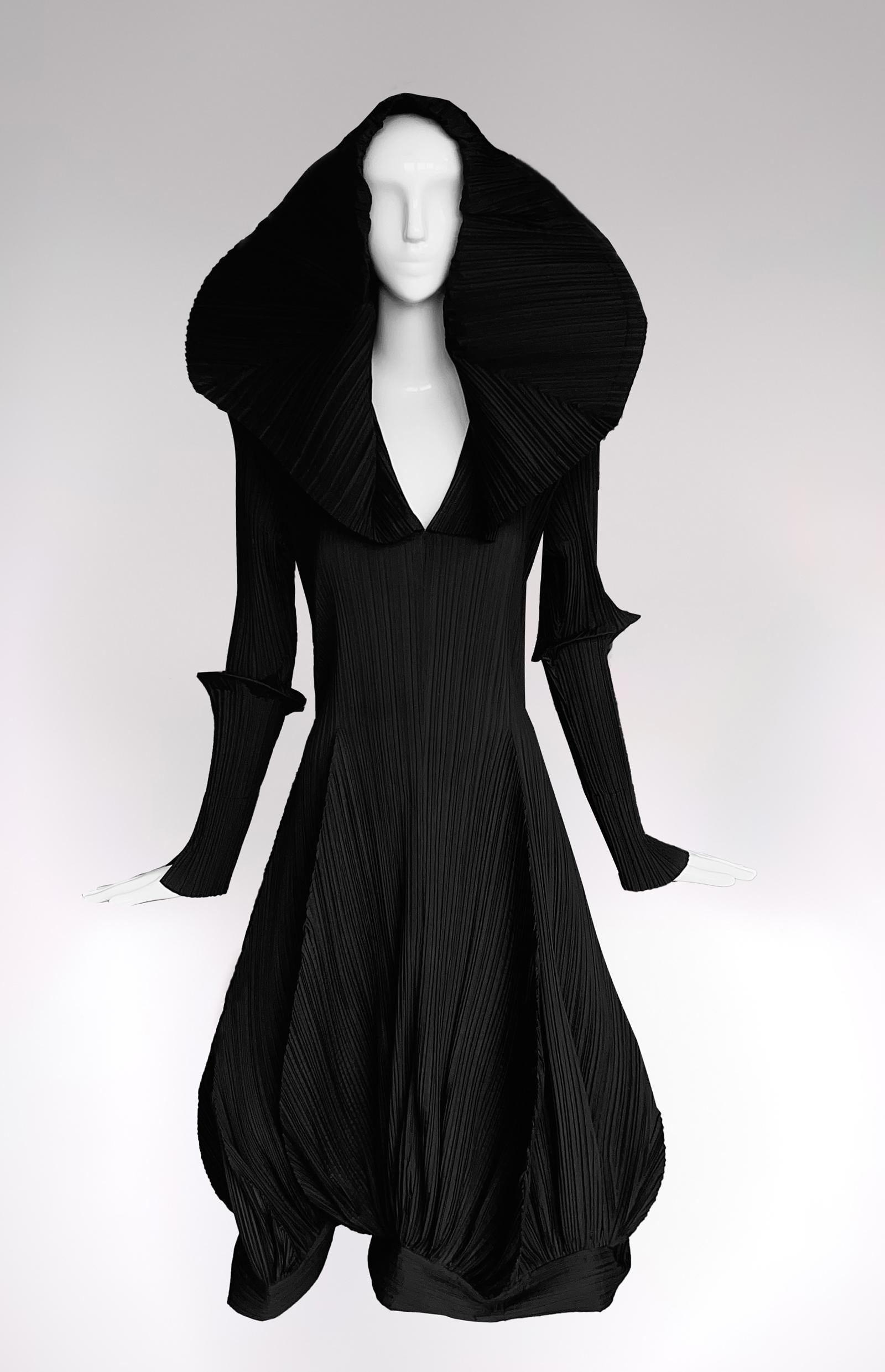 Wearble Art

Extremely rare and Museum worthy vintage Issey Miyake dress, assuming 1985 Collection. 

Gorgeous super dramatic piece of Fashion History.
Black sculptural statement dress. The big collar can be worn as hood, up or also down as shown on