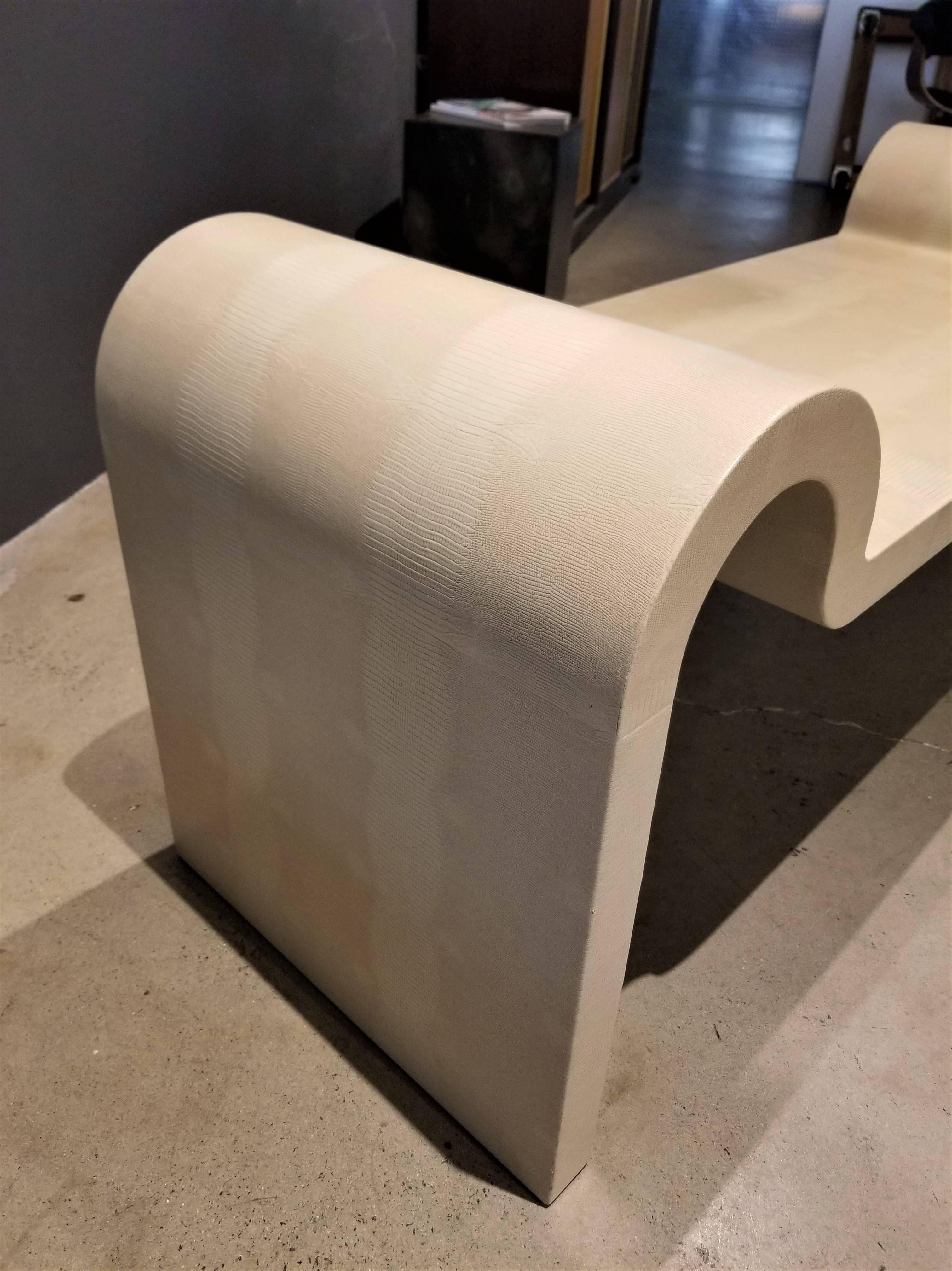 We are pleased to offer this iconic Karl Springer sculptural curved bench wrapped in cream colored lizard embossed leather. Signed and dated 1989. Excellent vintage condition with very few signs of wear. See detail images.

See this item at our