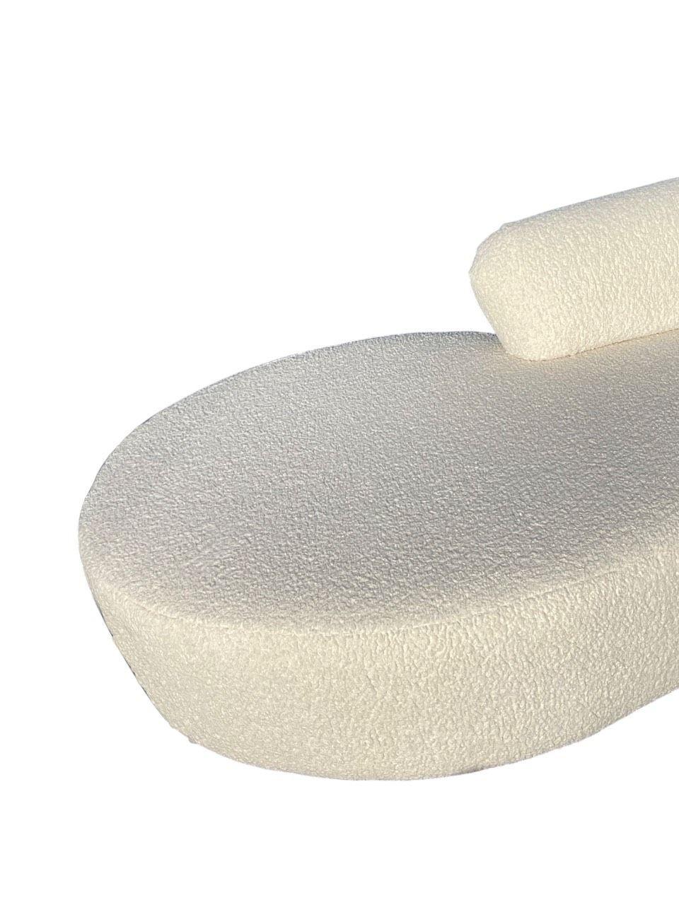 An iconic Serpentine Sofa by Vladimir Kagan, a masterpiece of mid-century modern design. This sculptural piece features Kagan's signature curvilinear form, designed to create an organic flow and inviting seating experience. Upholstered in a