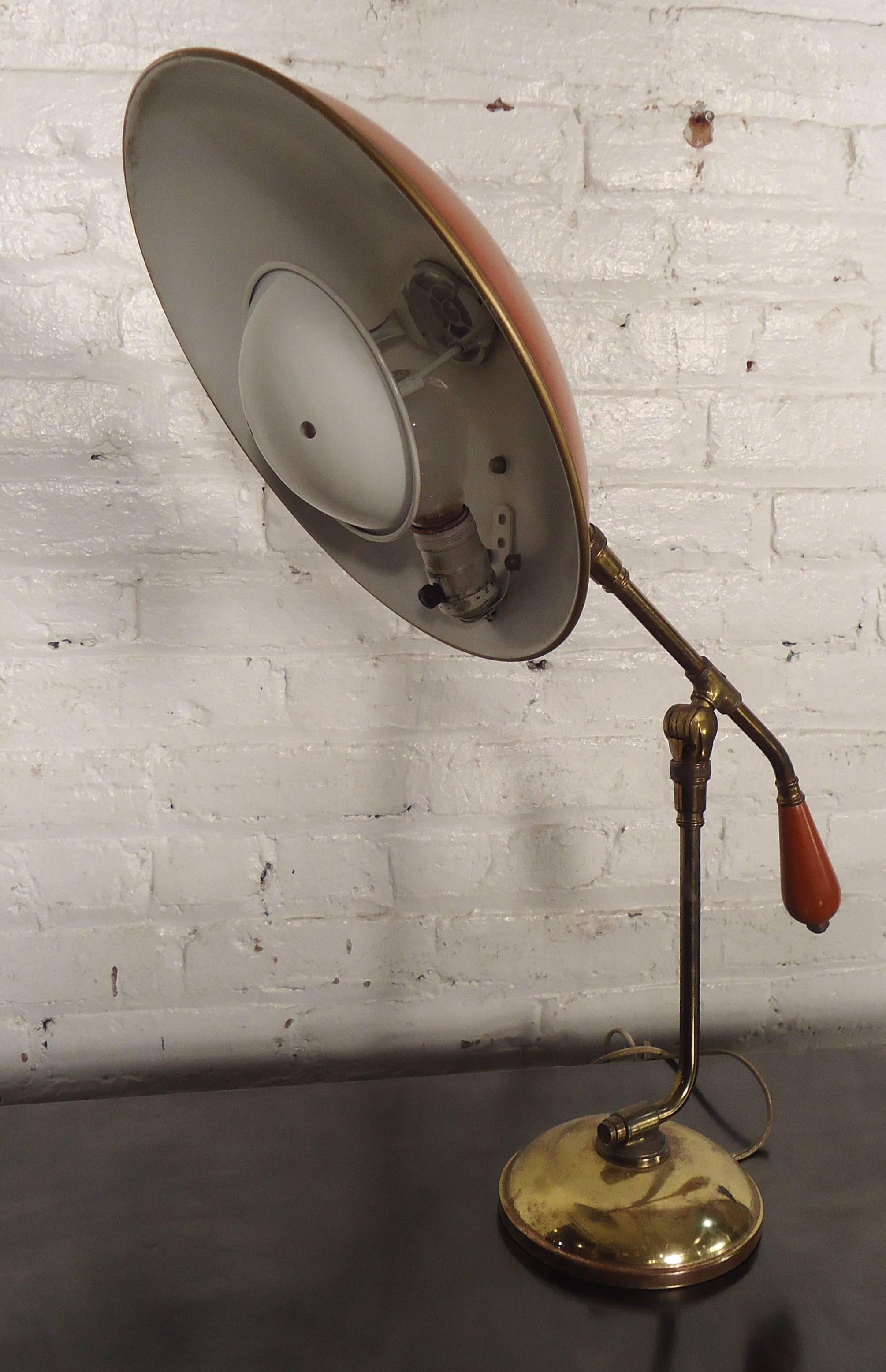 Handsome desk lamp by Gerald Thurston for Lightolier with saucer style shade and articulating design. Great design with bulb diffuser for warm but not blinding light.

(Please confirm item location - NY or NJ - with dealer).
 