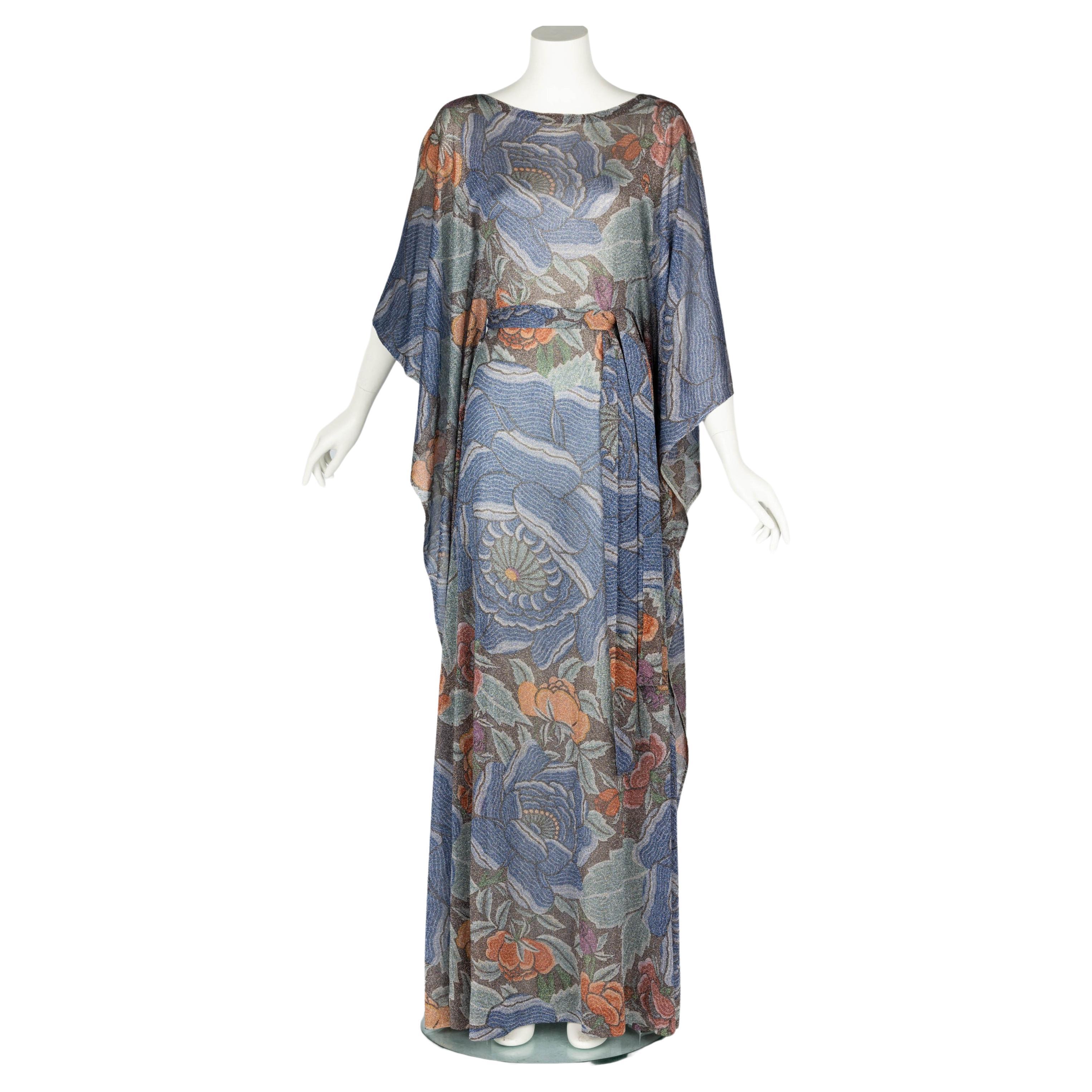 Highly coveted and collectible early 1970s rare Missoni caftan dress. Done in a beautiful lightweight metallic lurex fabric with an all-over captivating floral print.

Size estimate: X Small / Small
Shoulders: no defined seams
Bust: 32 inches
Waist: