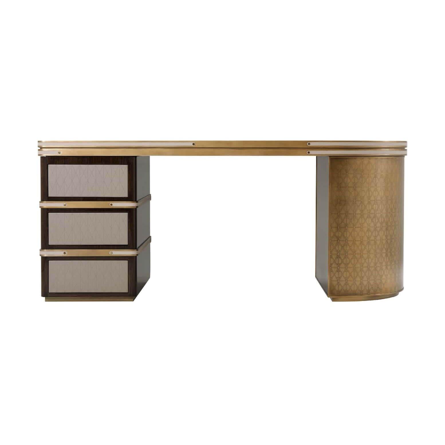 The iconic modern desk with parquetry veneered and lacquered top having brass inlaid details, Icon bronze bound top with inlaid brass strapped accents, the veneered pedestal with three geometric stitched leather panel drawers. The other bowed