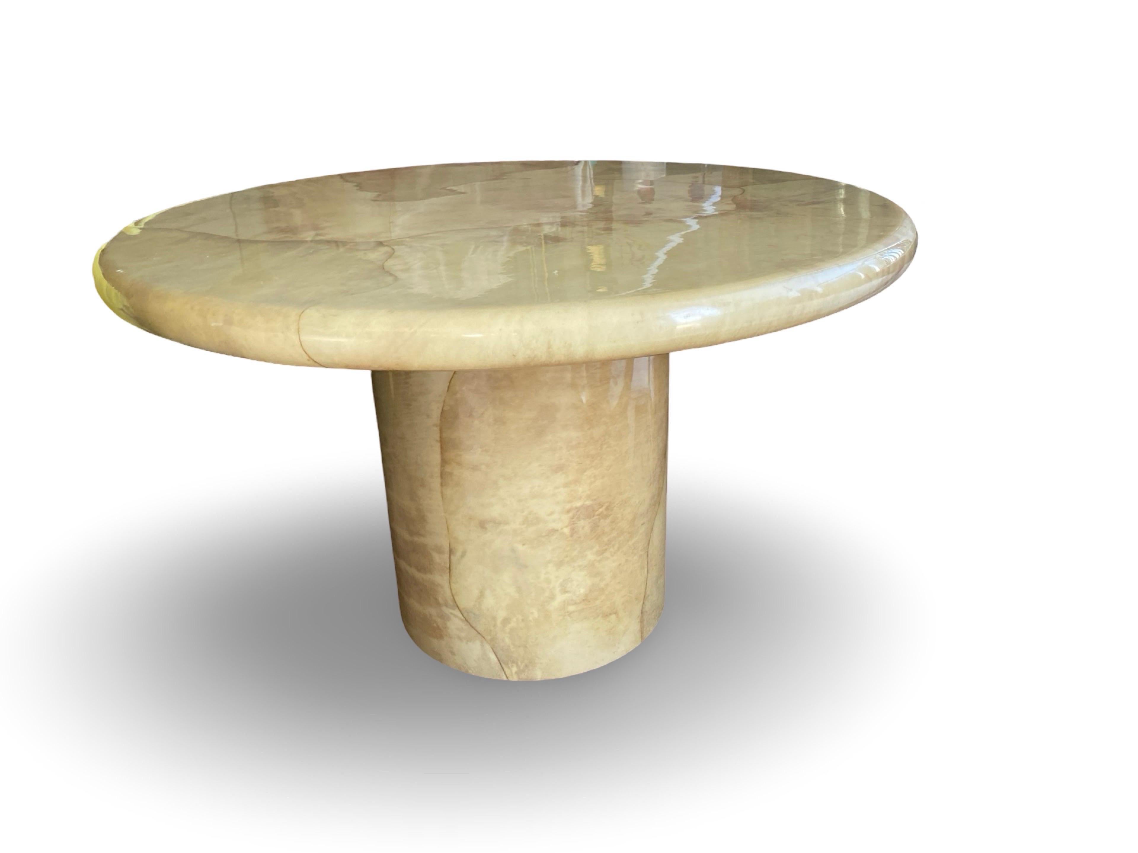 This table designed by legendary designer Karl Springer has become a 20th century modern iconic table. They are getting extremely hard to find. (Especially in good condition). 
This beautiful original design by Karl Springer was purchased for a